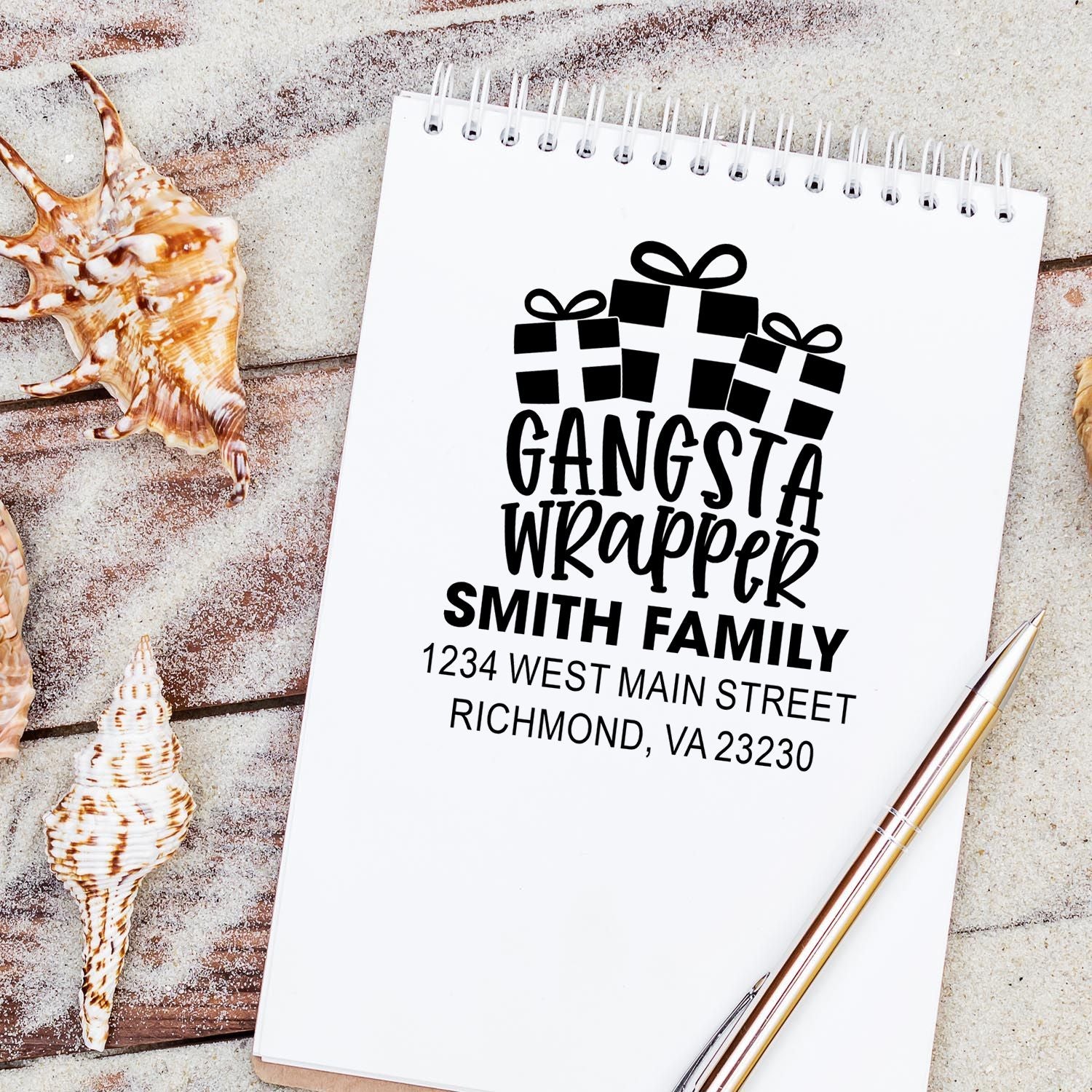 Personalized rubber stamp for gift wrap with presents icon, Gangsta Wrapper family name, and return address.