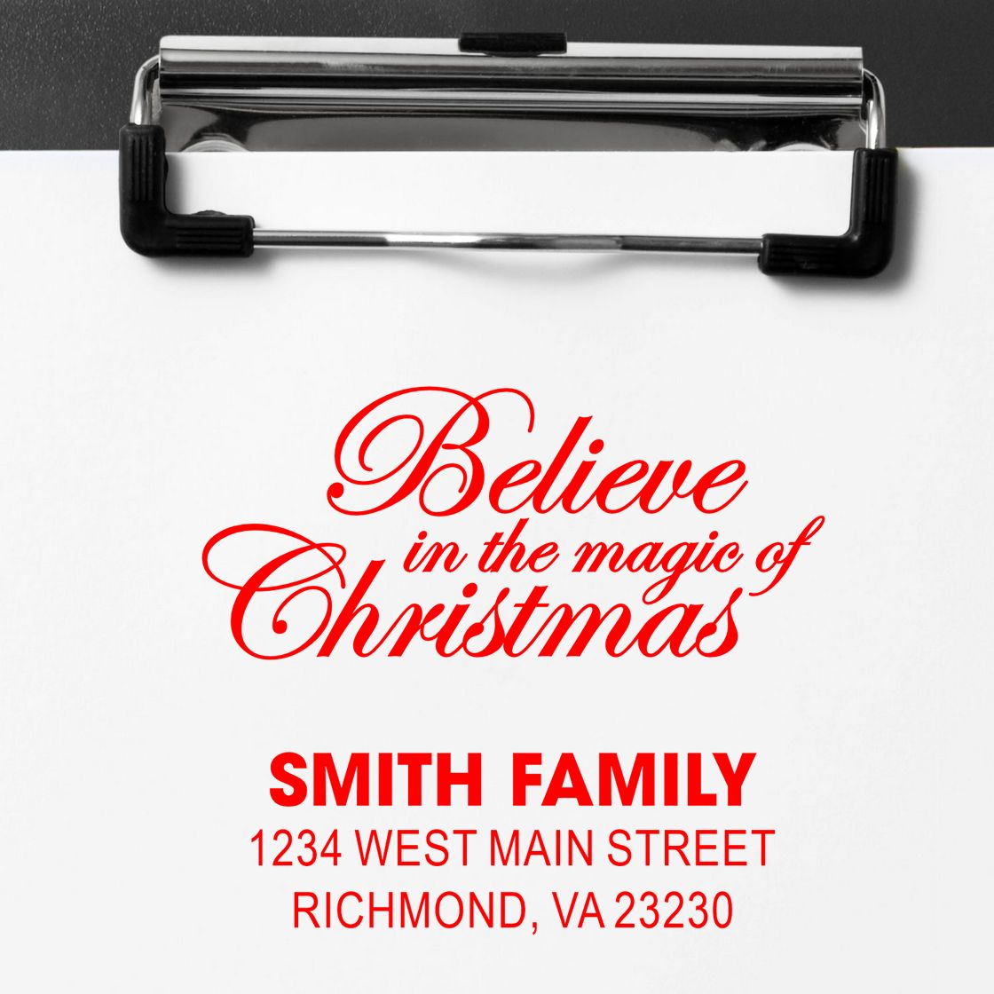 Custom Christmas rubber stamp mockup with Believe in the magic of Christmas and Smith Family return address design.