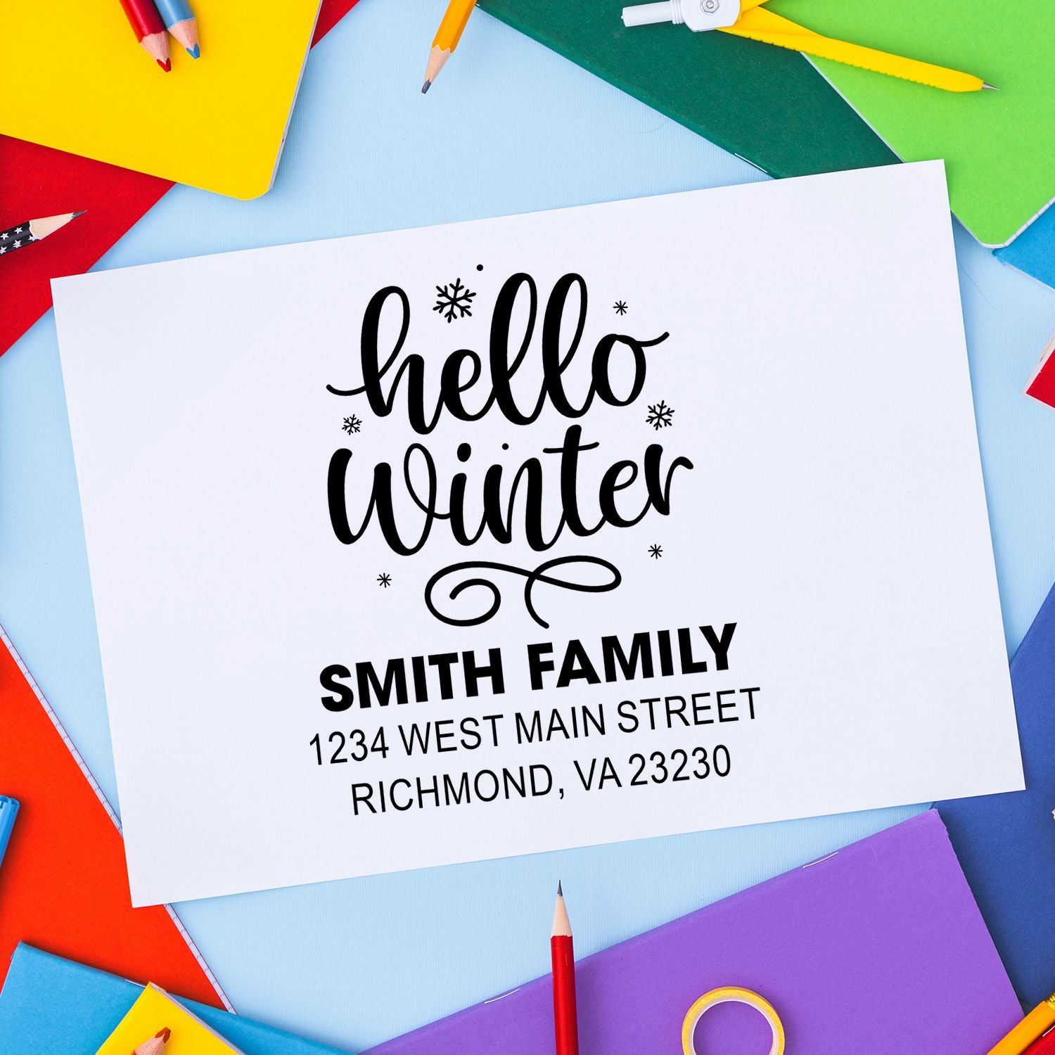 Custom rubber stamp design with Hello Winter and Smith Family address for personalized holiday cards and stationery.