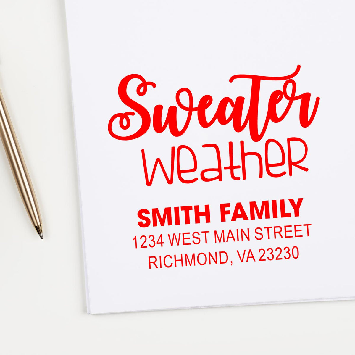 Custom rubber stamp mockup with Sweater Weather design and Smith family address for personalized stationery.