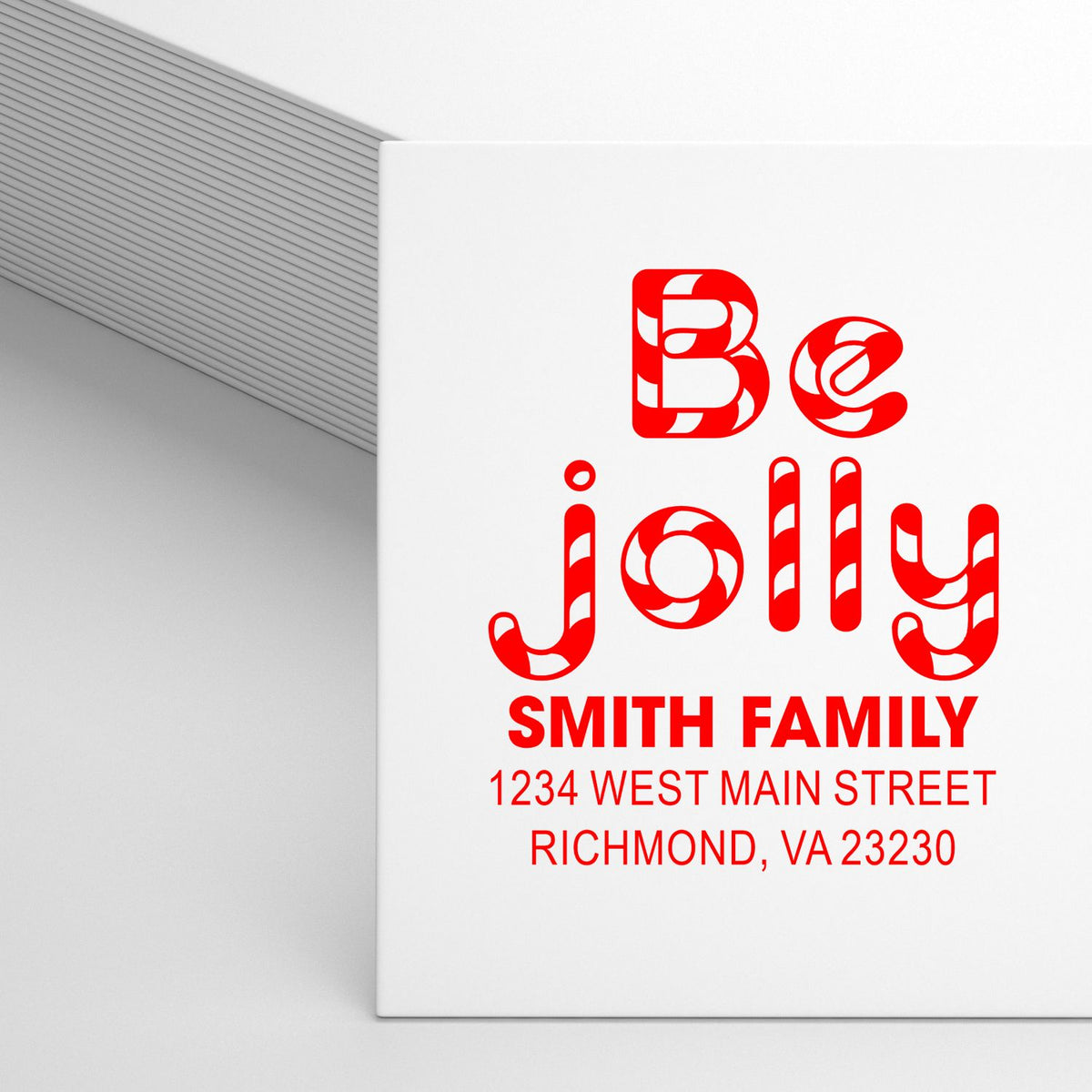 Custom holiday rubber stamp with Be Jolly design, Smith Family name, and return address for festive Christmas card envelopes.
