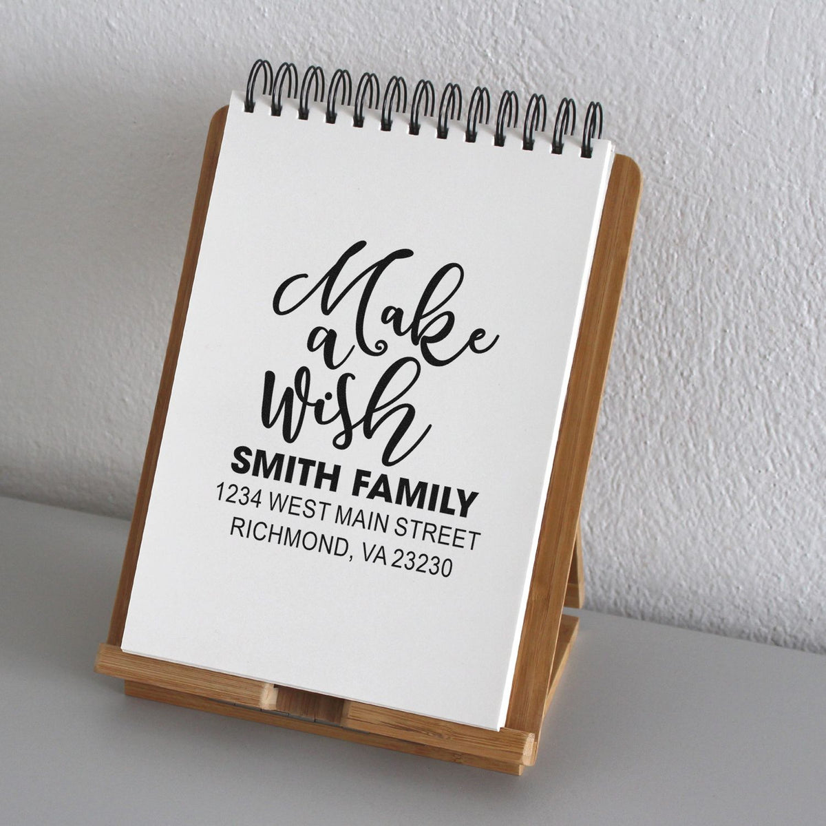 Custom return address rubber stamp sample with Make a wish script for Smith Family, Richmond, VA.