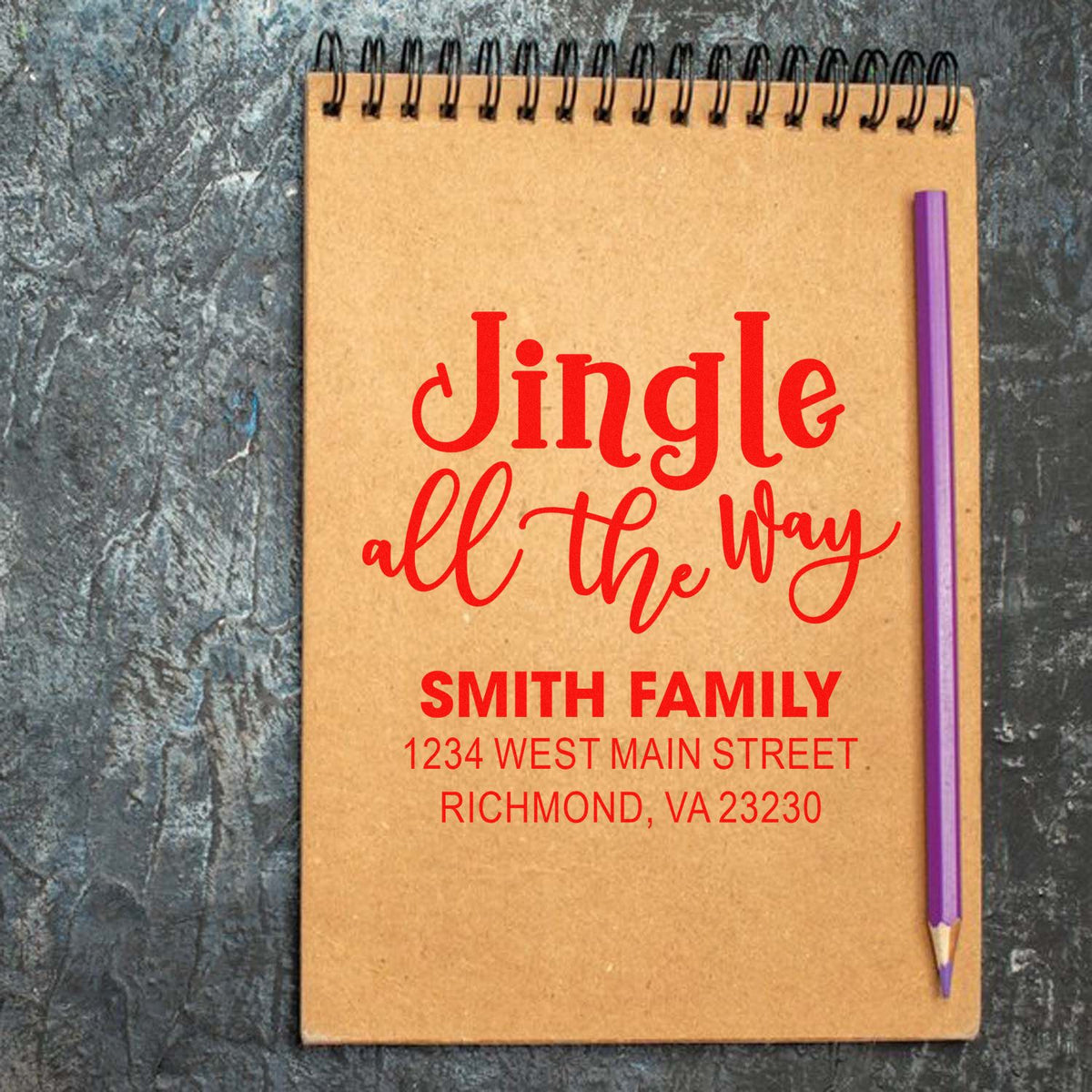 Personalized holiday rubber stamp mockup with Jingle All the Way and Smith family return address for festive envelopes.