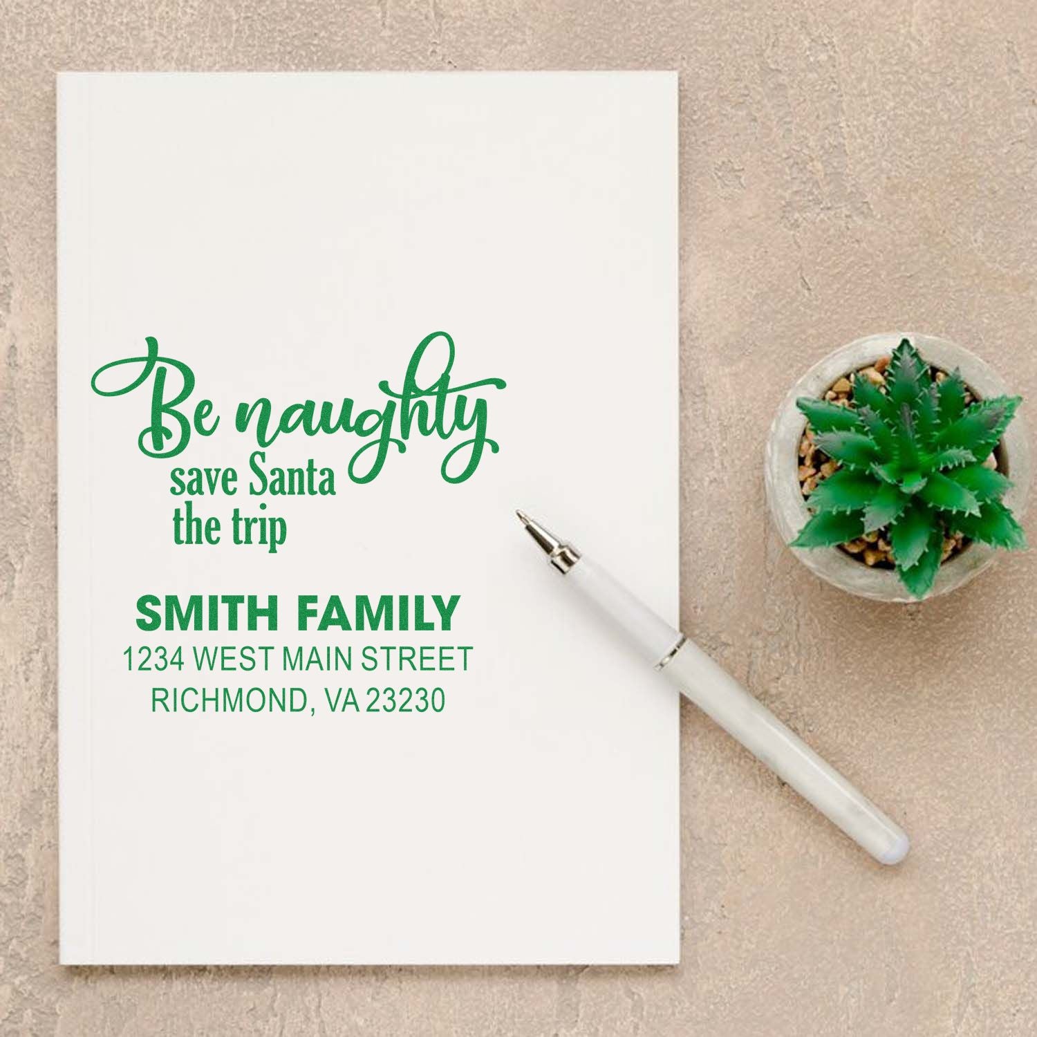 Custom holiday return address rubber stamp with Be naughty, save Santa the trip for the Smith family.
