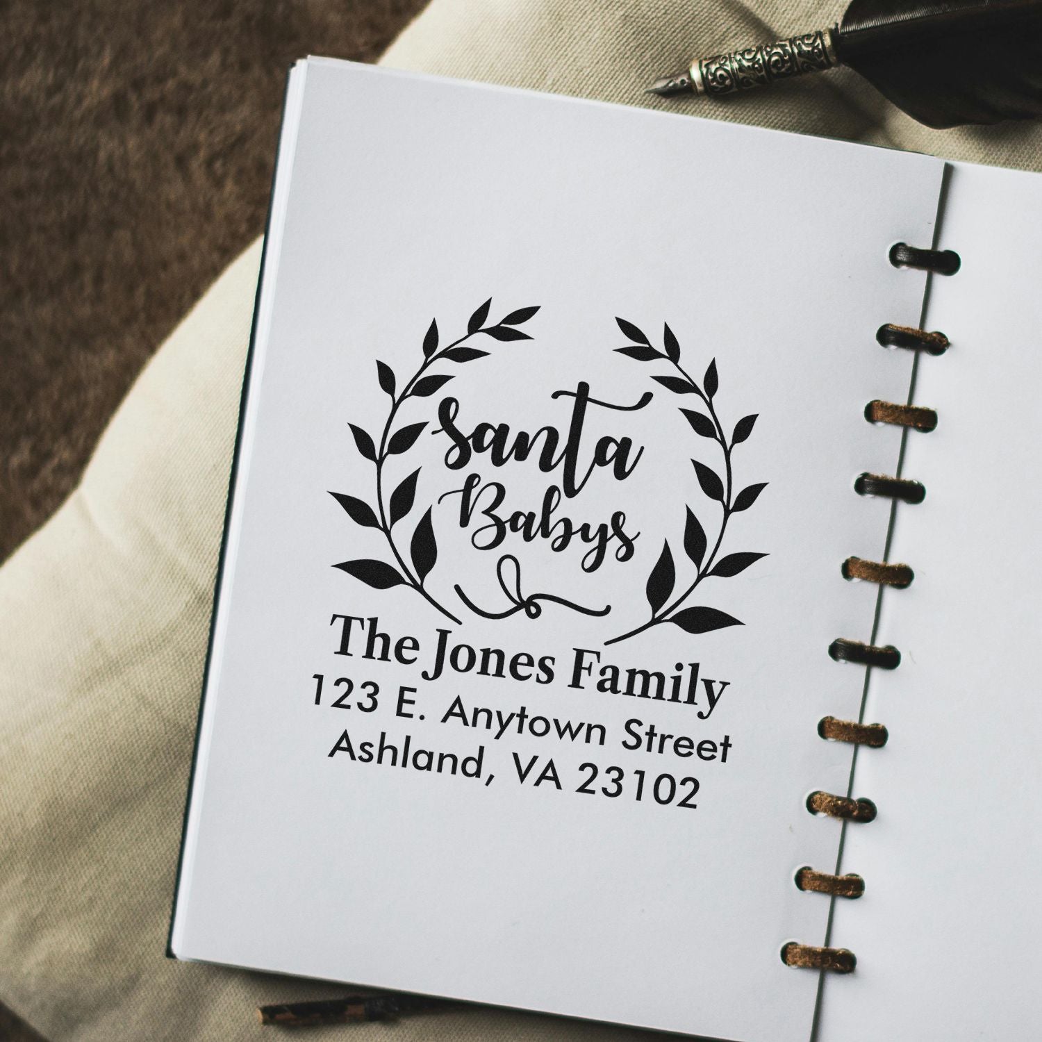 Custom Santa Baby return address rubber stamp with wreath design for The Jones Family holiday mail.