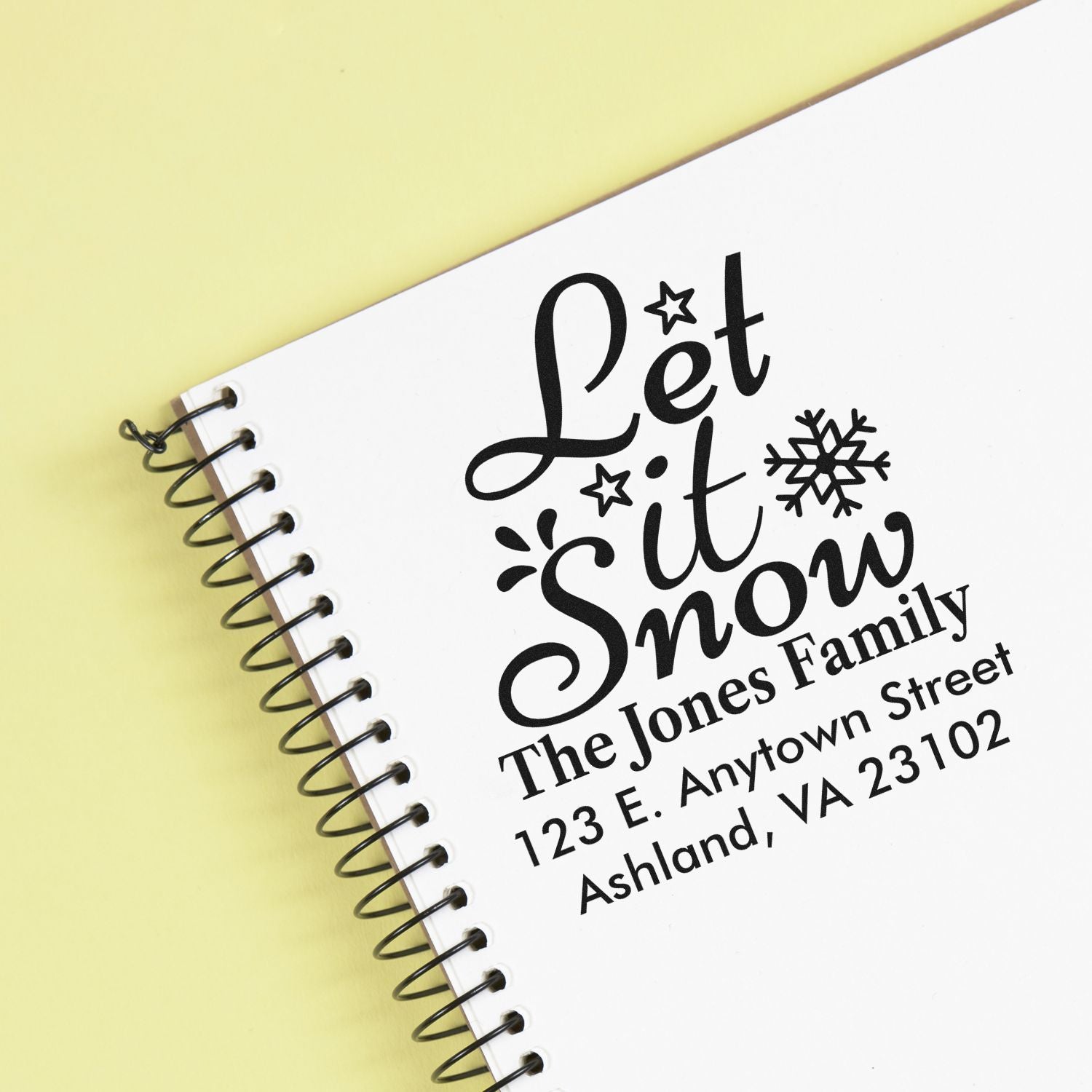 Custom holiday rubber stamp design with Let It Snow and family address for winter stationery and gift packaging