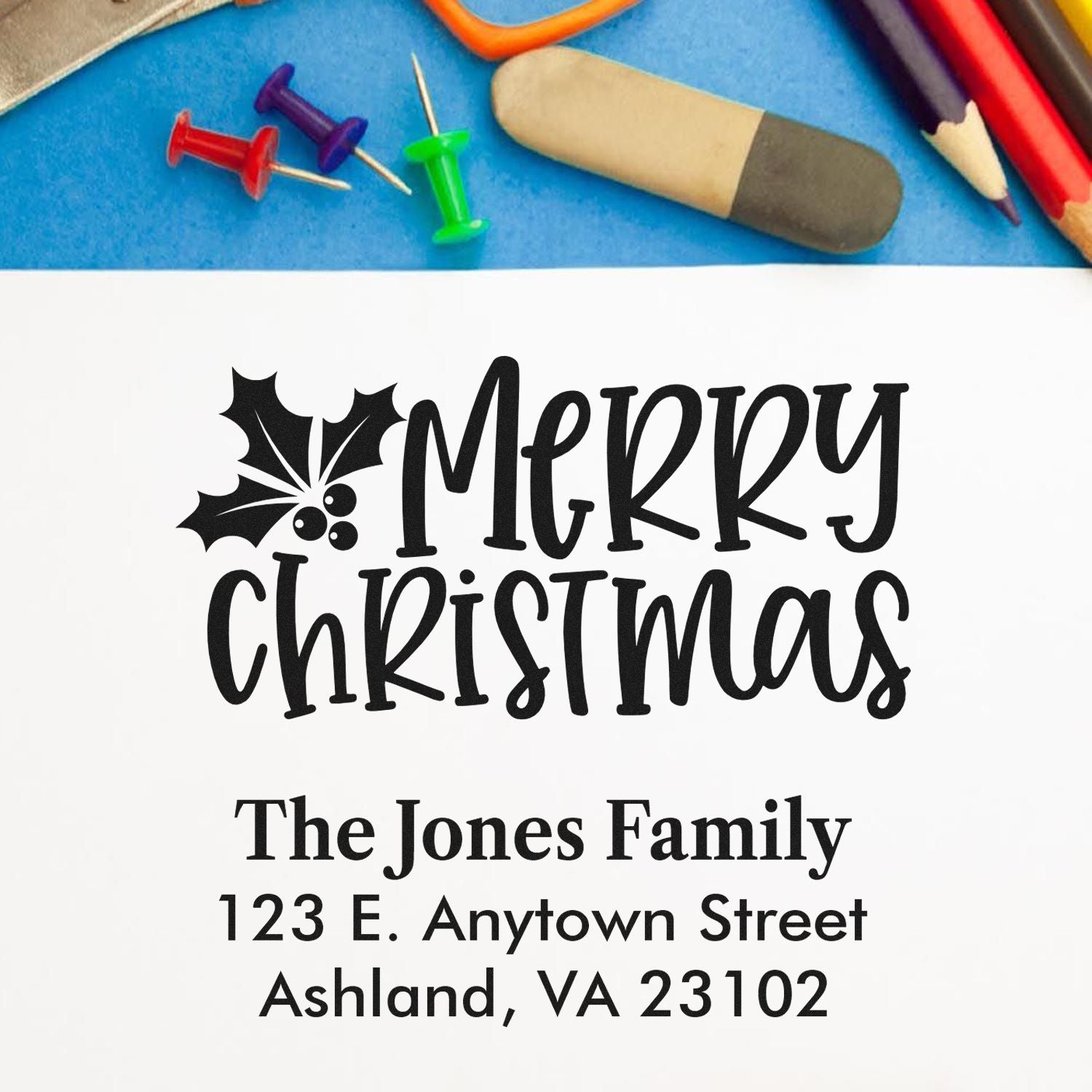 Personalized Merry Christmas address rubber stamp with holly design, family name, and return address for holiday mail.