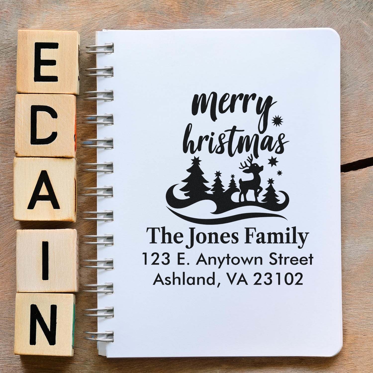 Custom Merry Christmas return address rubber stamp with reindeer and family name for holiday stationery.