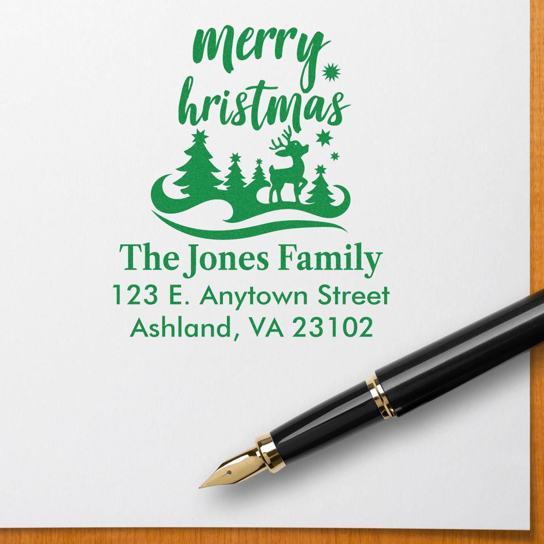 Personalized Merry Christmas return address rubber stamp with family name, address, deer, and trees for holiday cards.