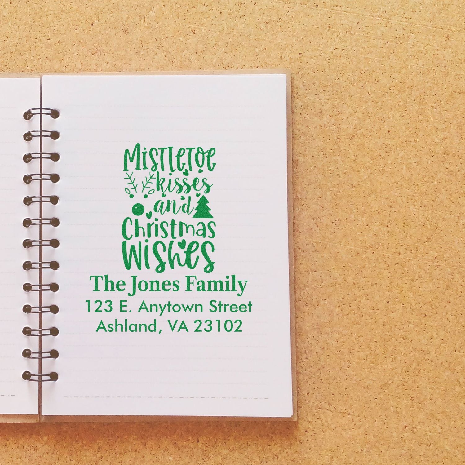 Custom Christmas return address rubber stamp with Mistletoe Kisses and Christmas Wishes for The Jones Family.