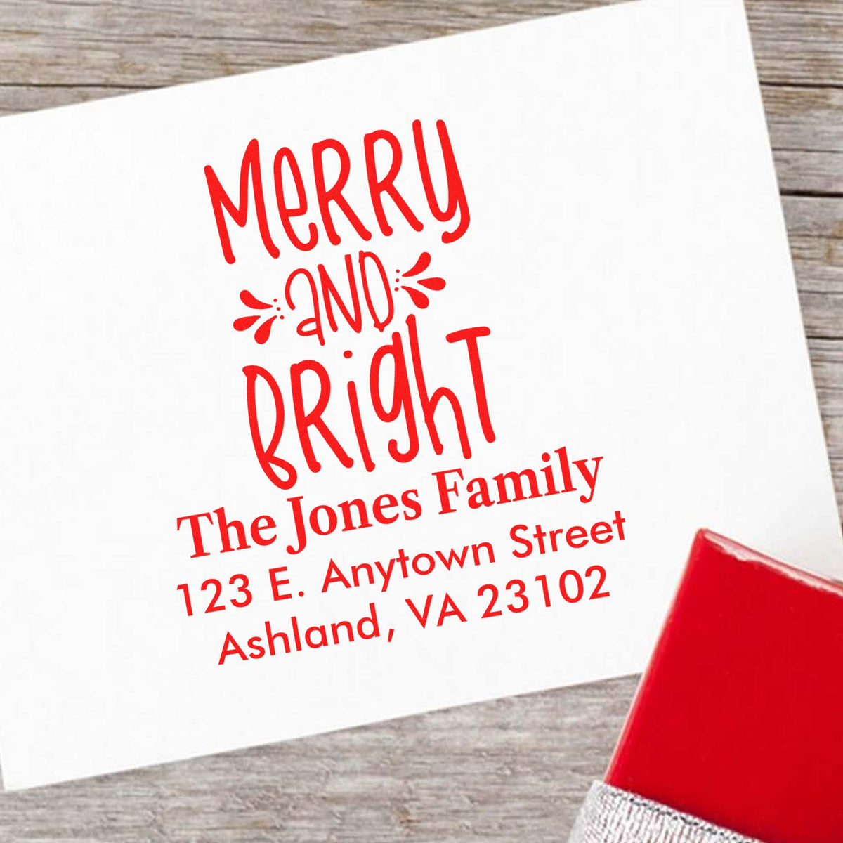 Custom Merry and Bright rubber stamp with family name and return address for holiday cards and Christmas envelopes.