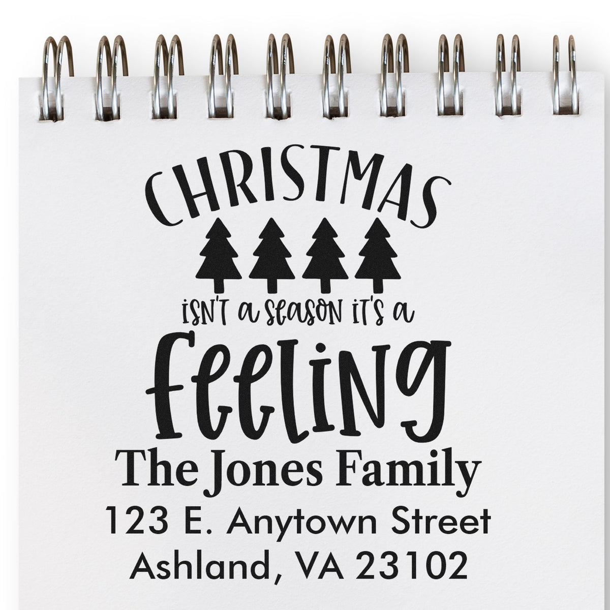 Custom Christmas rubber stamp with family name and address for holiday cards and festive return address stamping.