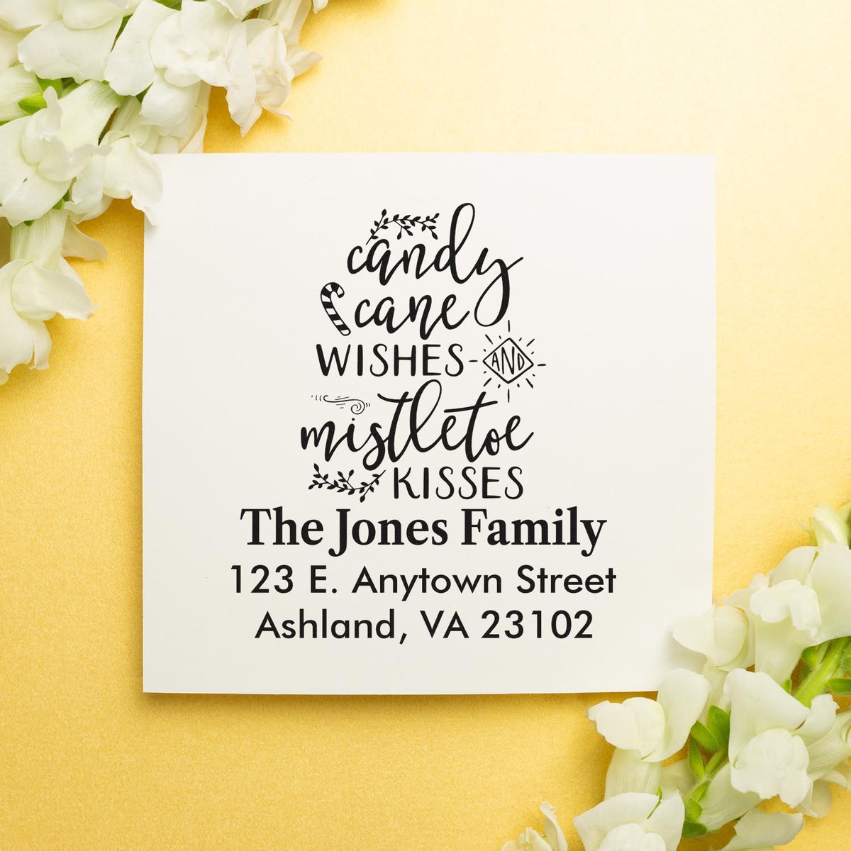 Personalized Christmas rubber stamp with Candy Cane Wishes and Mistletoe Kisses and family return address.