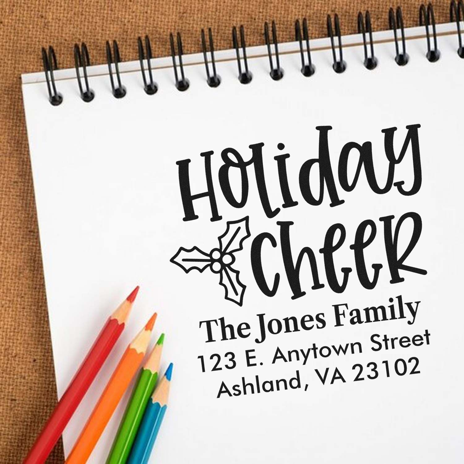 Holiday Cheer custom address rubber stamp with family name, street address, and holly design for festive mailing.