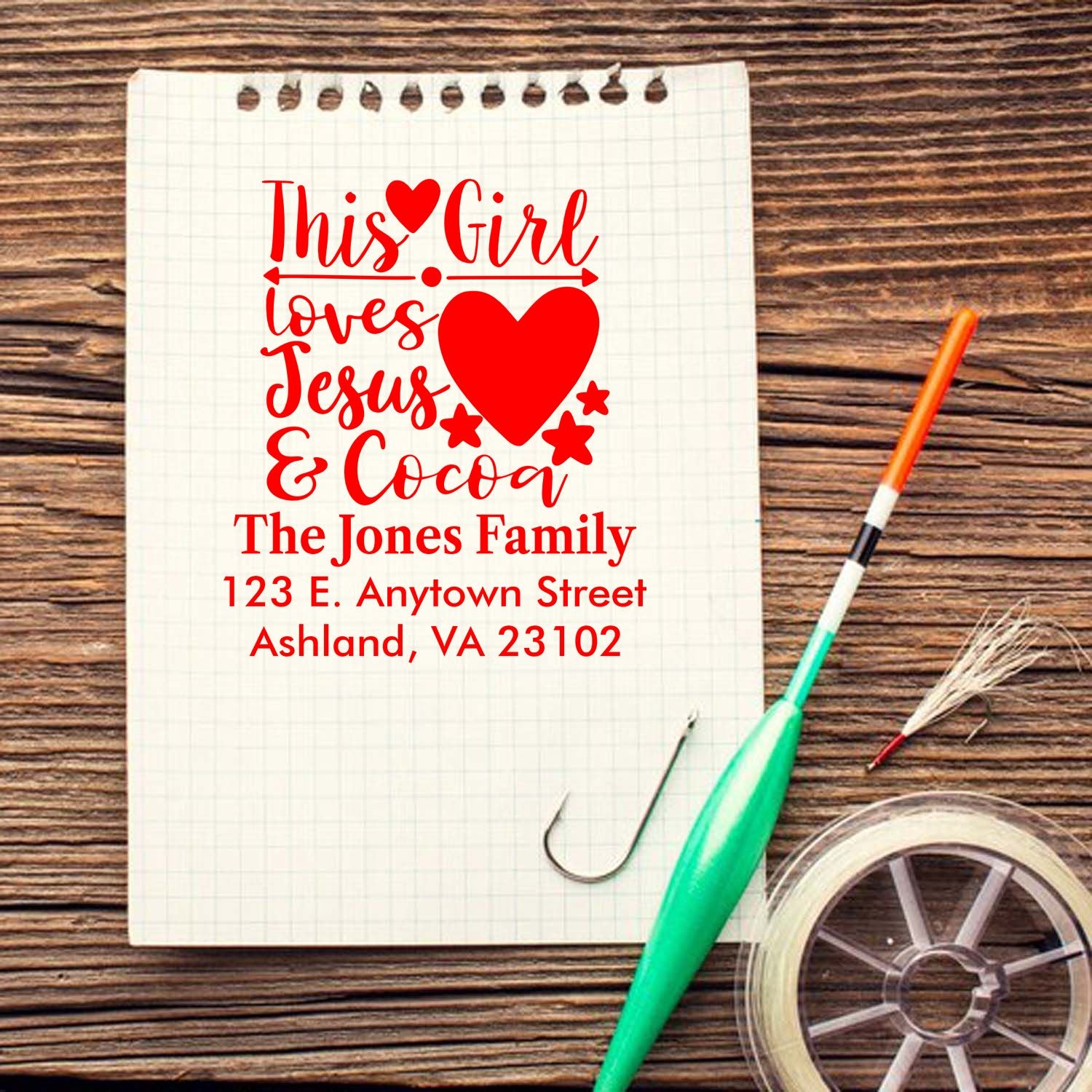 Personalized rubber stamp design reading This Girl Loves Jesus & Cocoa with family name and address.