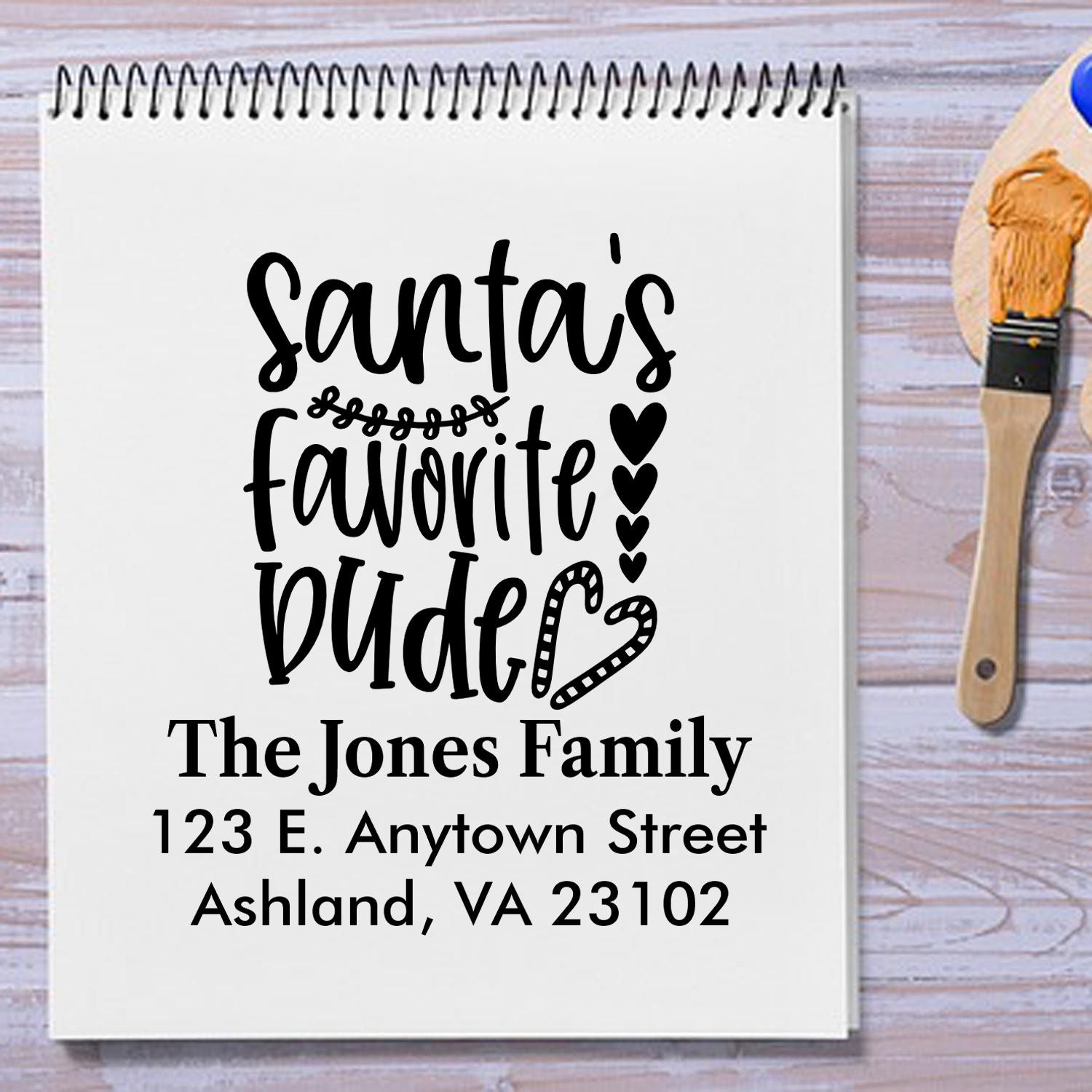 Personalized Christmas rubber stamp design reading Santas Favorite Dude with family name and return address.