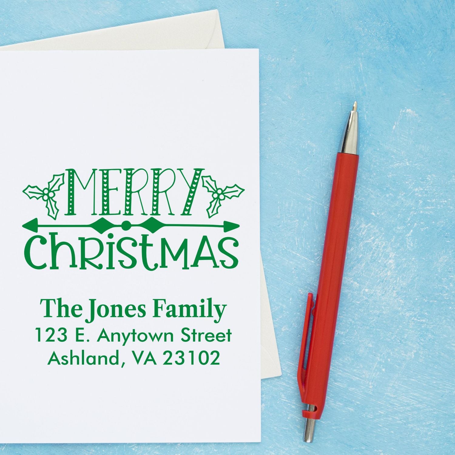 Custom Merry Christmas return address rubber stamp for holiday cards, featuring The Jones Family address and holly design.