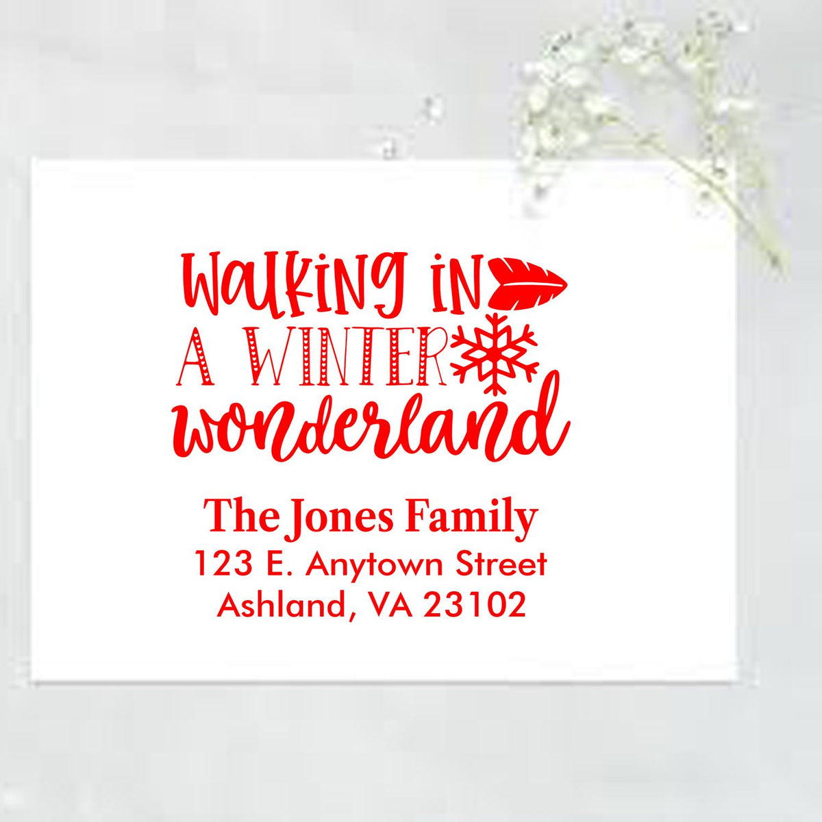 Custom Christmas address rubber stamp featuring Walking in a Winter Wonderland and a personalized family return address.