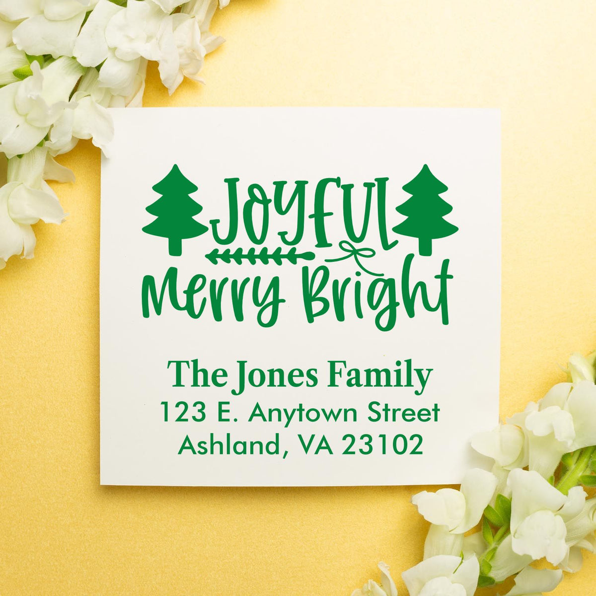 Personalized Christmas rubber stamp design with Joyful Merry Bright, pine trees, and family address for holiday cards.
