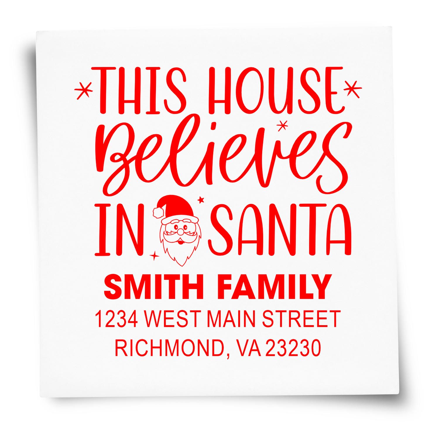 Personalized Christmas return address rubber stamp reading This House Believes in Santa with family name and address for holiday mail.