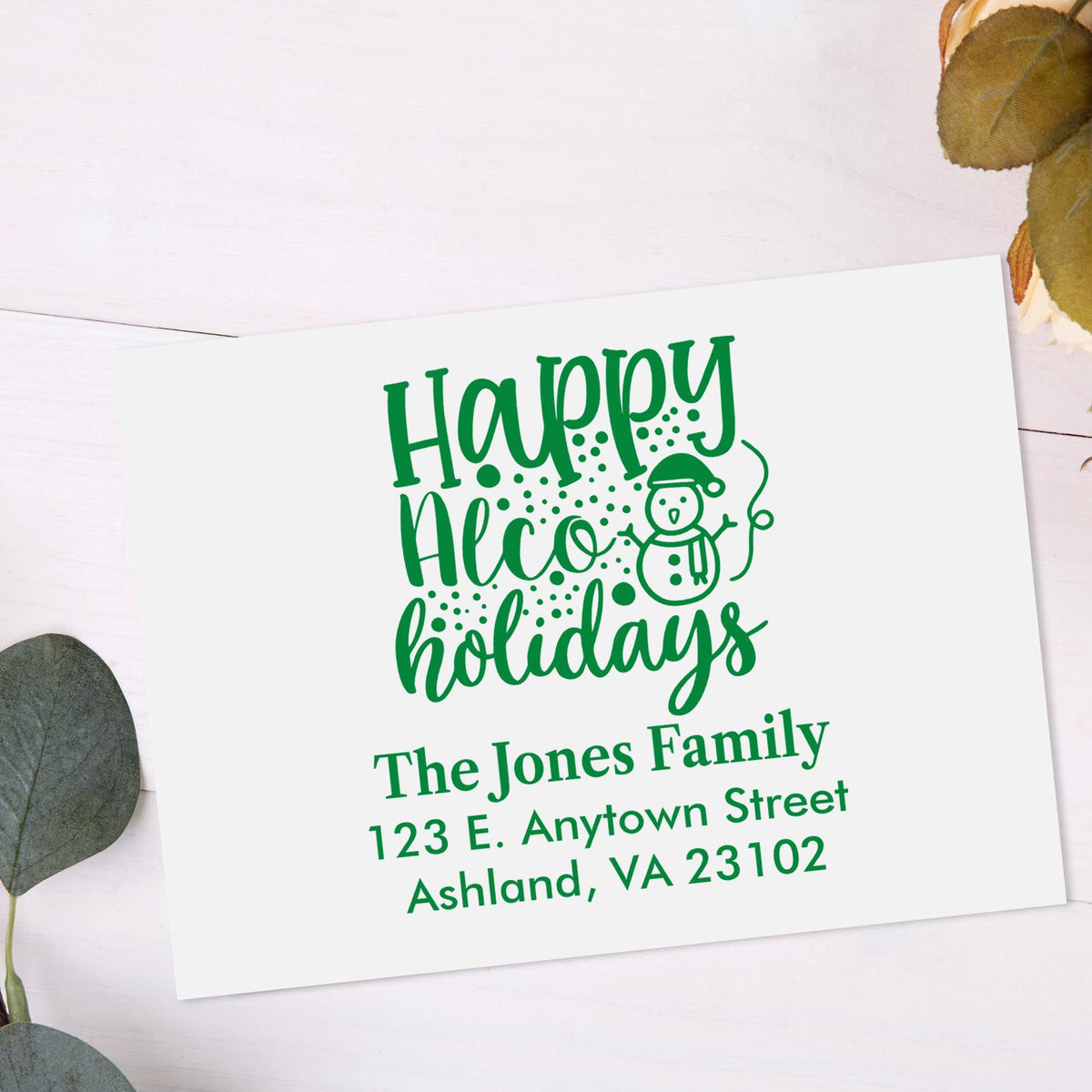 Custom holiday return address rubber stamp with snowman design and family name for festive Christmas card envelopes.