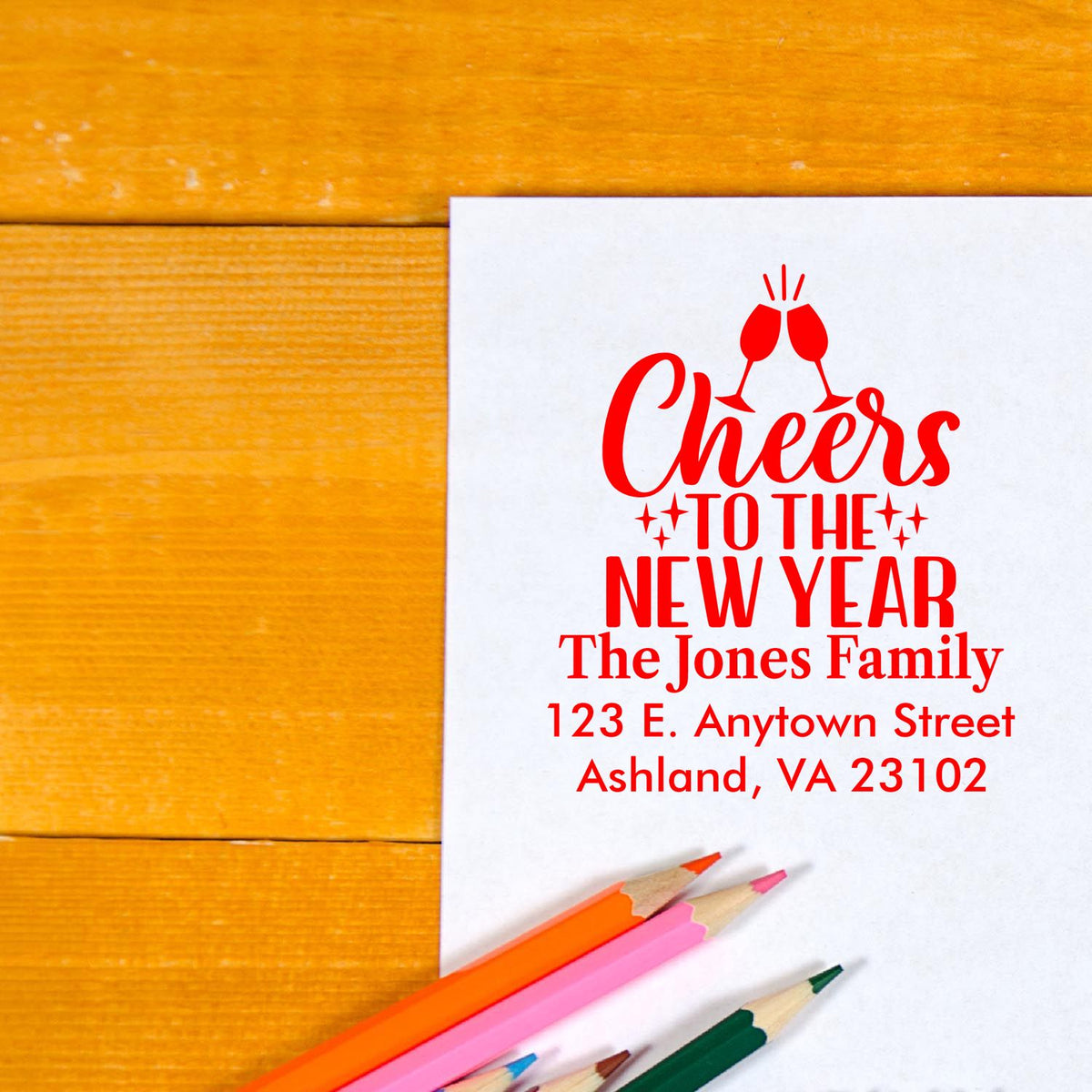 Personalized rubber stamp for New Year cards with Cheers to the New Year message, family name, and return address.