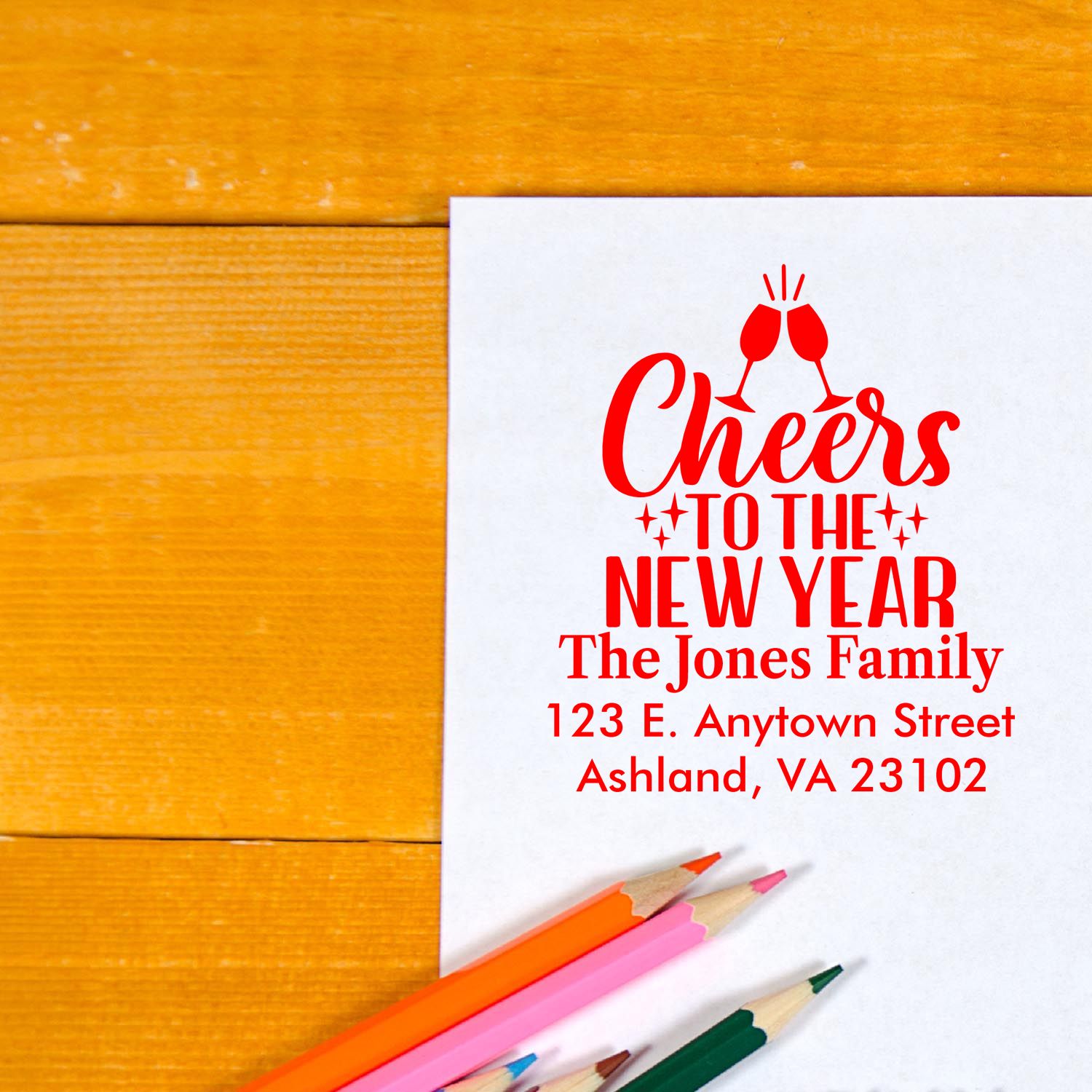 Personalized Cheers to the New Year rubber stamp design for holiday cards with family name and address.