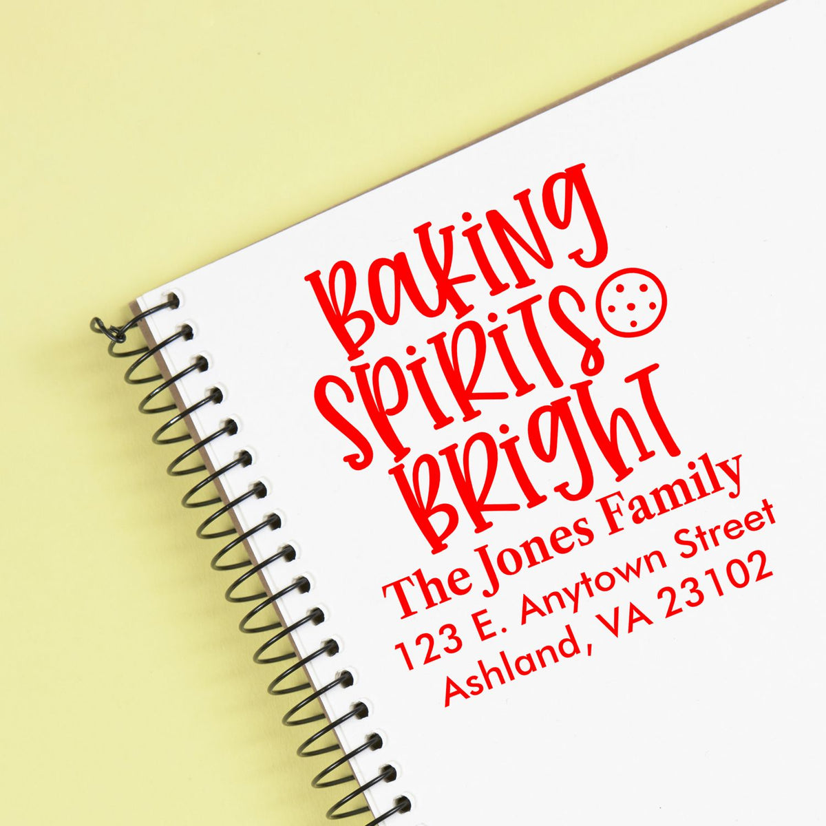 Custom address rubber stamp reading Baking Spirits Bright with The Jones Family and Ashland, VA address.