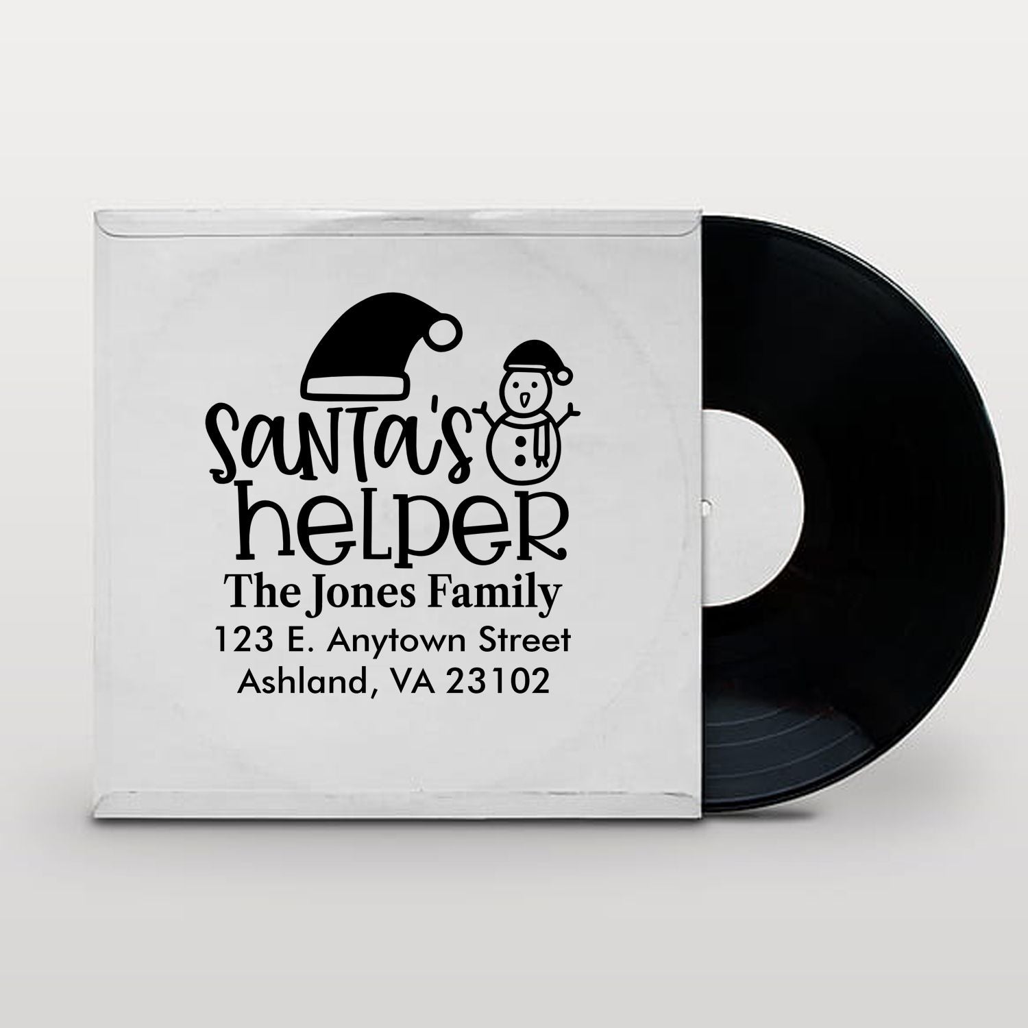 Personalized Santas Helper rubber stamp with family name and address for Christmas cards, holiday packages, and festive mail.