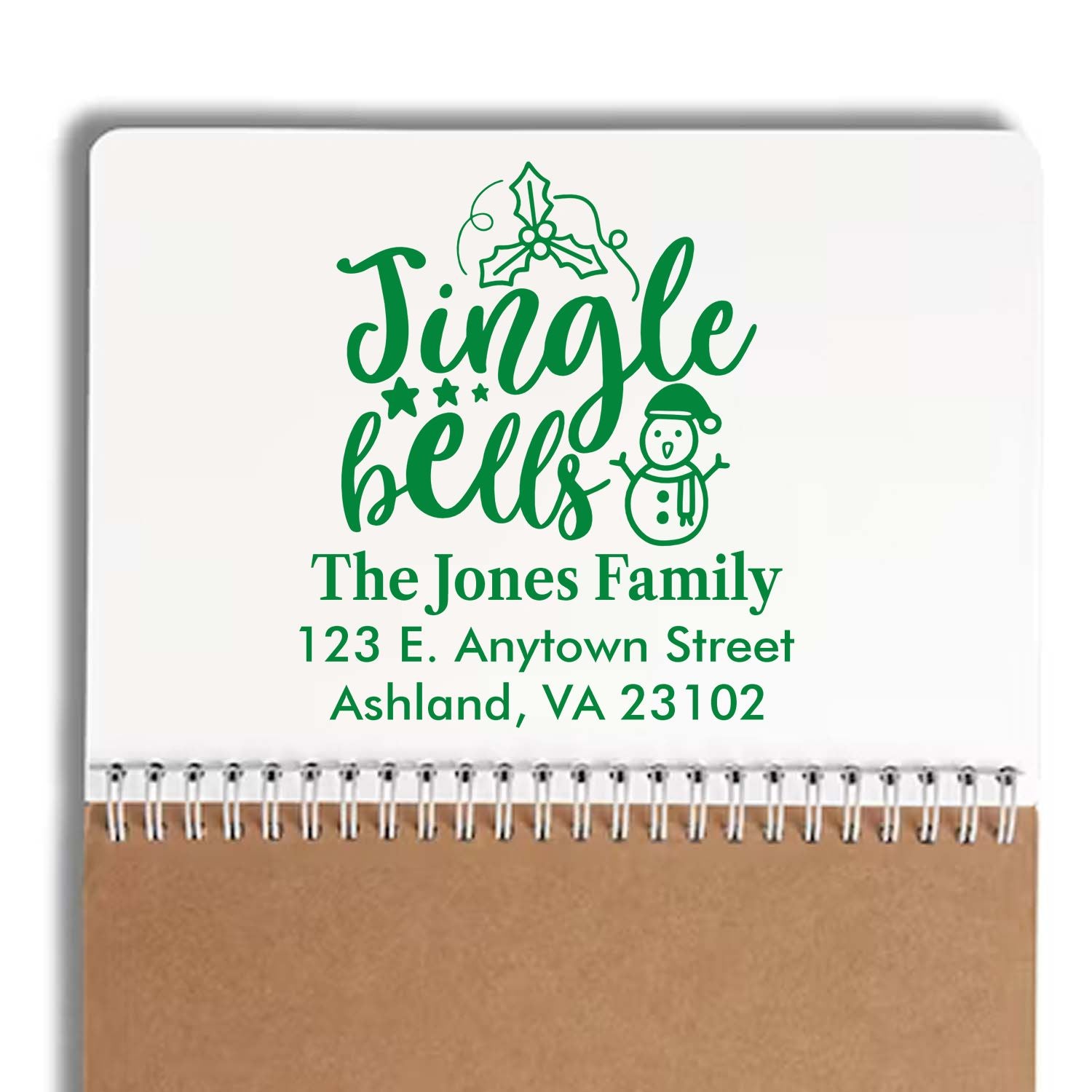 Custom holiday return address rubber stamp with Jingle Bells design, snowman, and family name for Christmas cards.