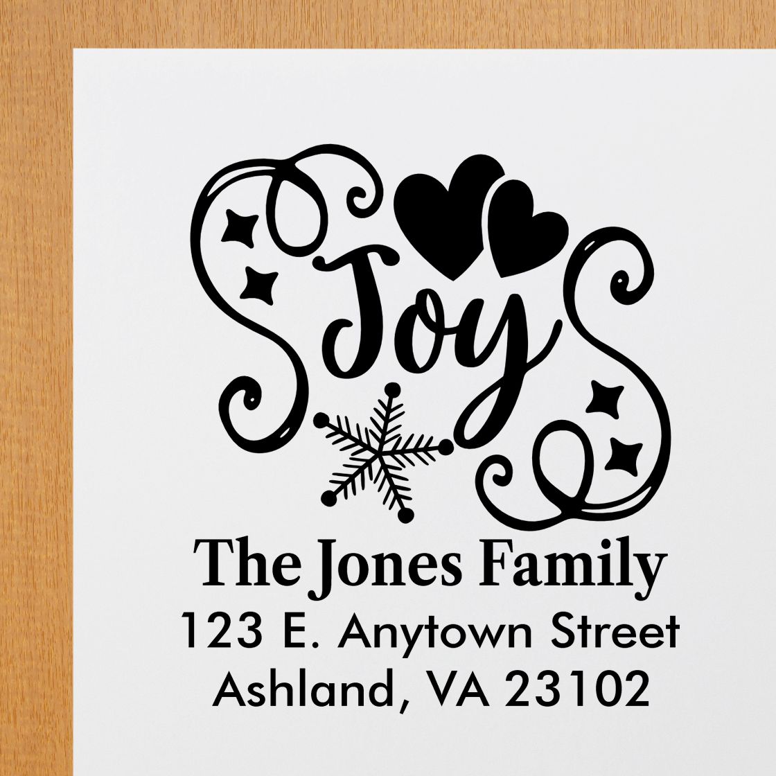 Personalized holiday return address rubber stamp with Joy, hearts, snowflake, and The Jones Family address for mailings.
