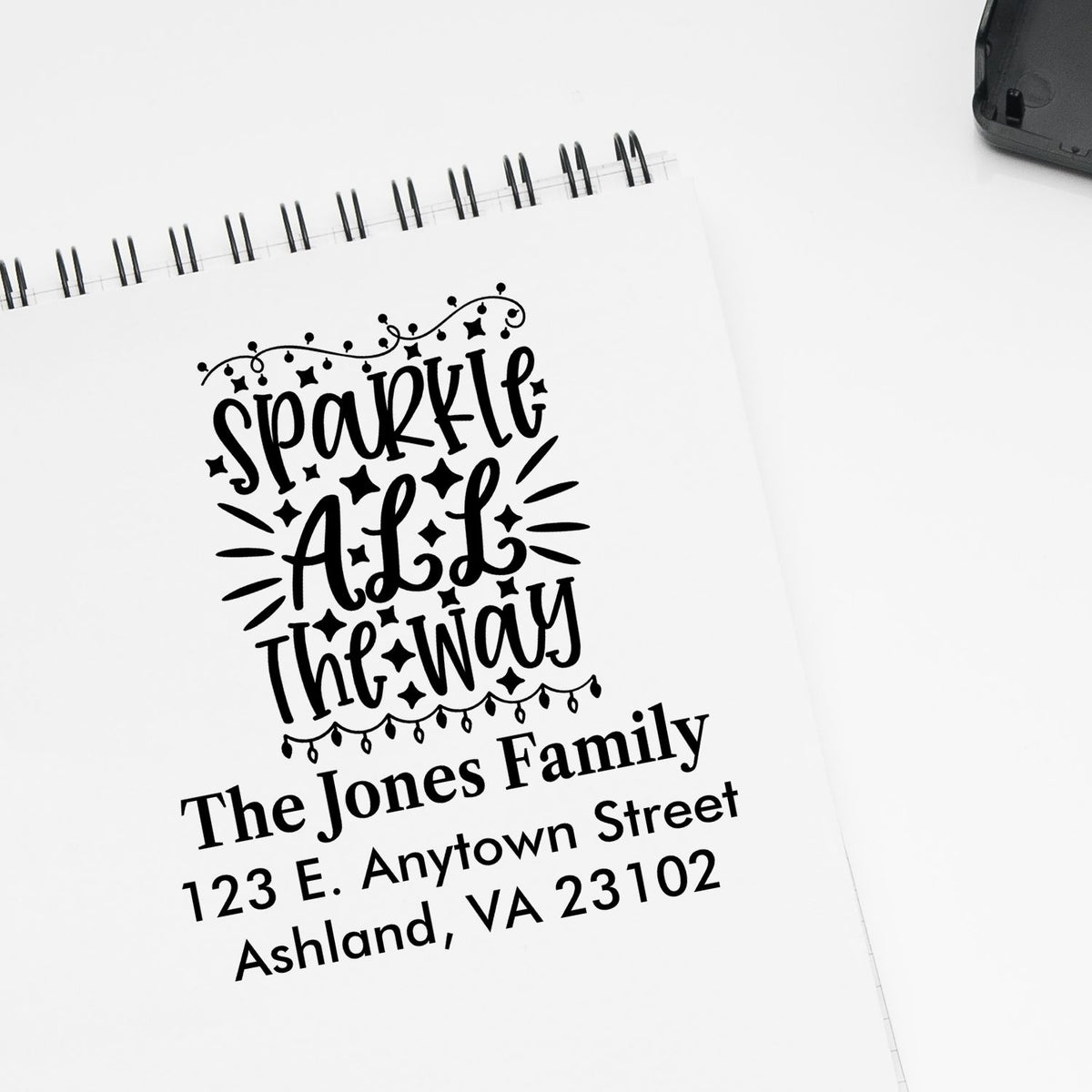 Custom holiday return address rubber stamp reading Sparkle All the Way for The Jones Family.