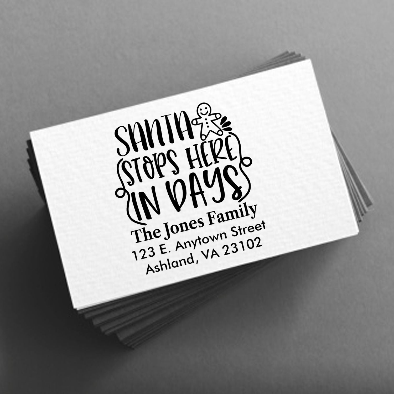 Custom holiday address rubber stamp with Santa Stops Here in Days design for The Jones Family return address cards.