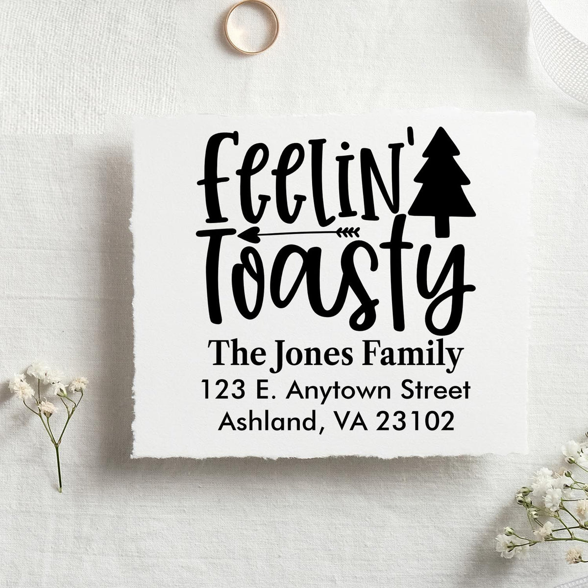 Personalized Feelin Toasty return address rubber stamp with tree design, custom family name, and address for holiday cards.