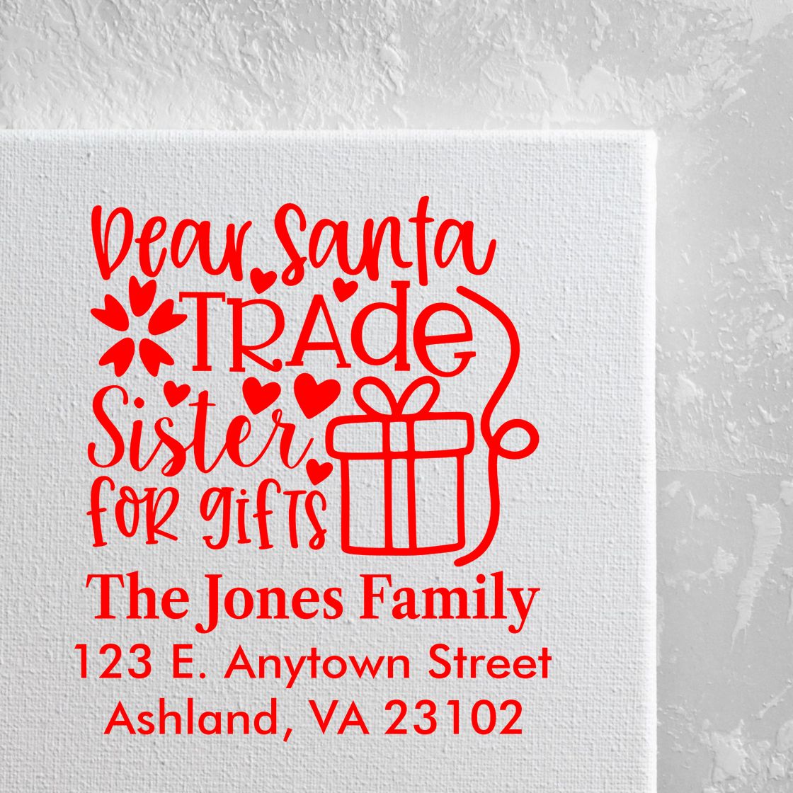 Personalized Christmas rubber stamp for Santa letters, featuring a gift-trade message, family name, and address.