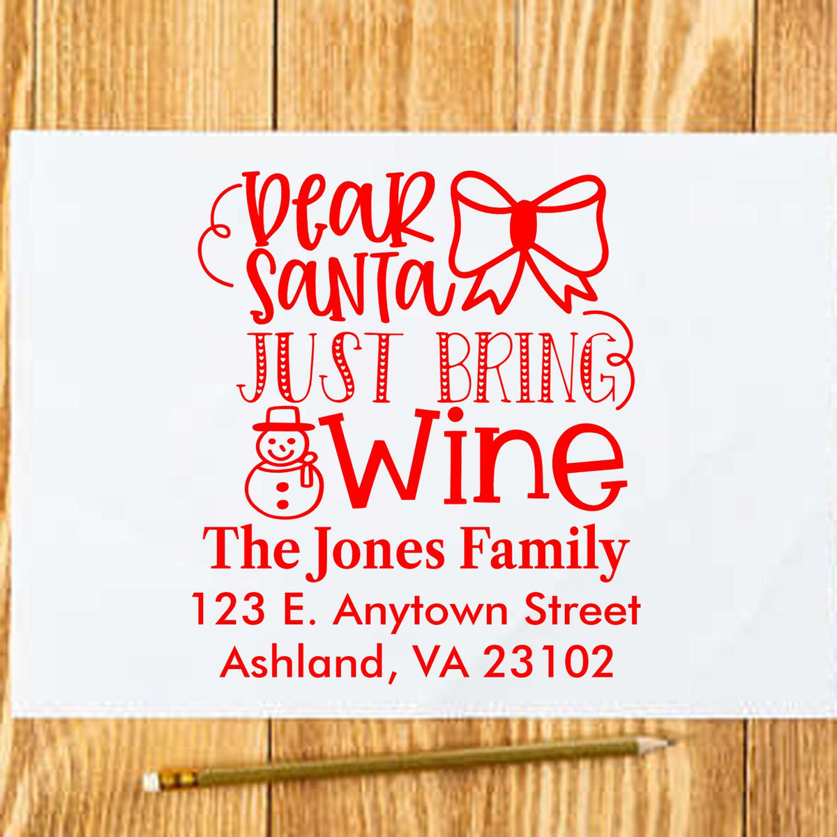 Custom Christmas rubber stamp design reading Dear Santa Just Bring Wine with personalized family name and address.
