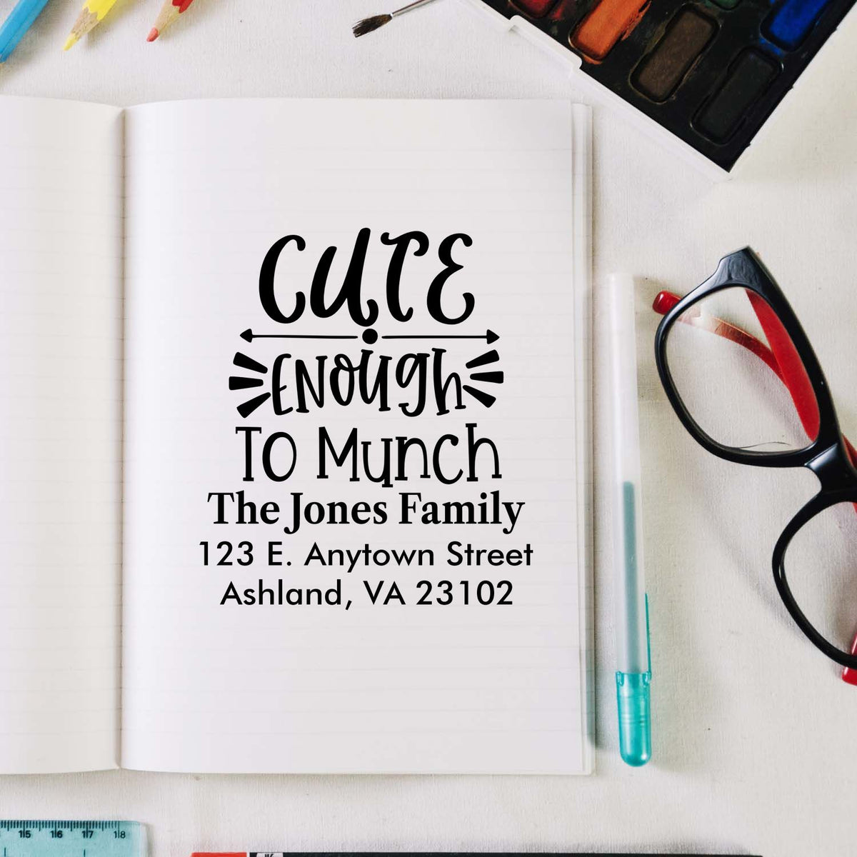 Custom rubber address stamp with Cute Enough To Munch design for The Jones Family, personalized with name and address.