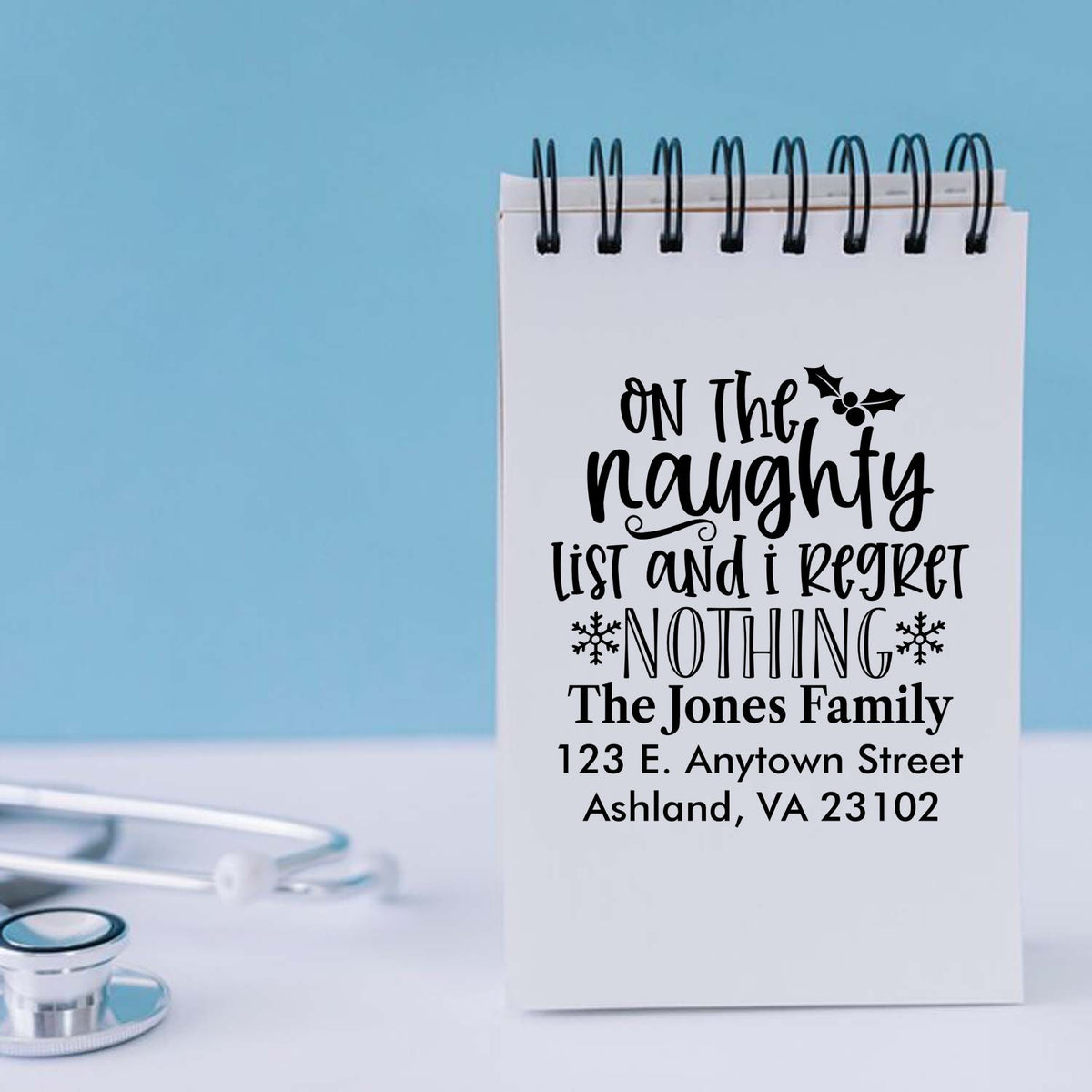 Custom holiday address rubber stamp with naughty list quote for The Jones Family, personalized Christmas mail stamp.