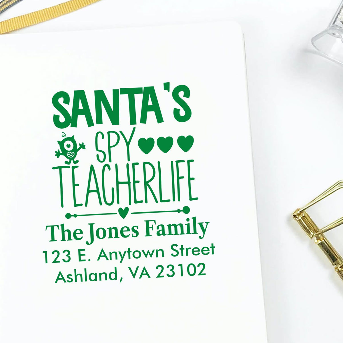 Personalized Christmas return address rubber stamp for teachers, featuring Santas Spy Teacherlife and family address.