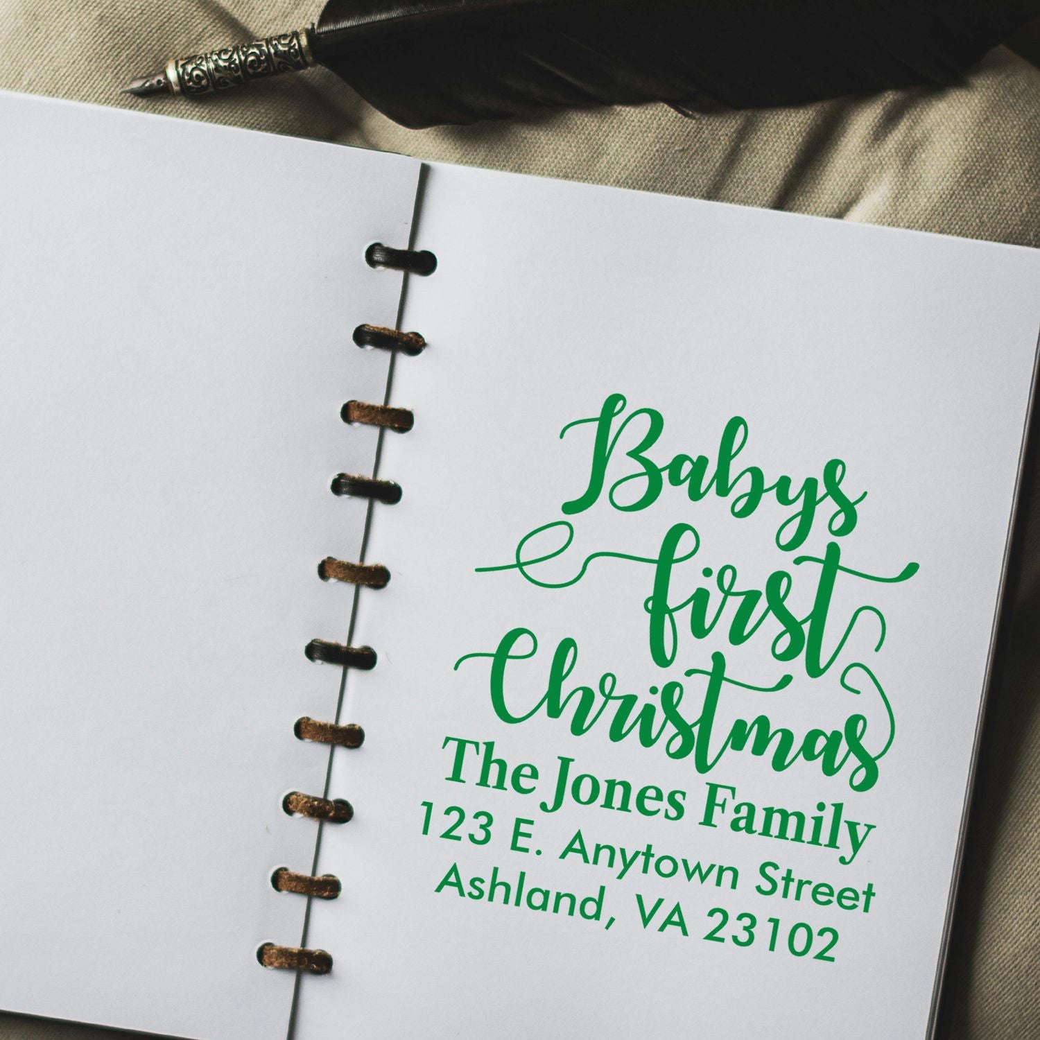 Custom return address rubber stamp for Babys First Christmas with family name and address.