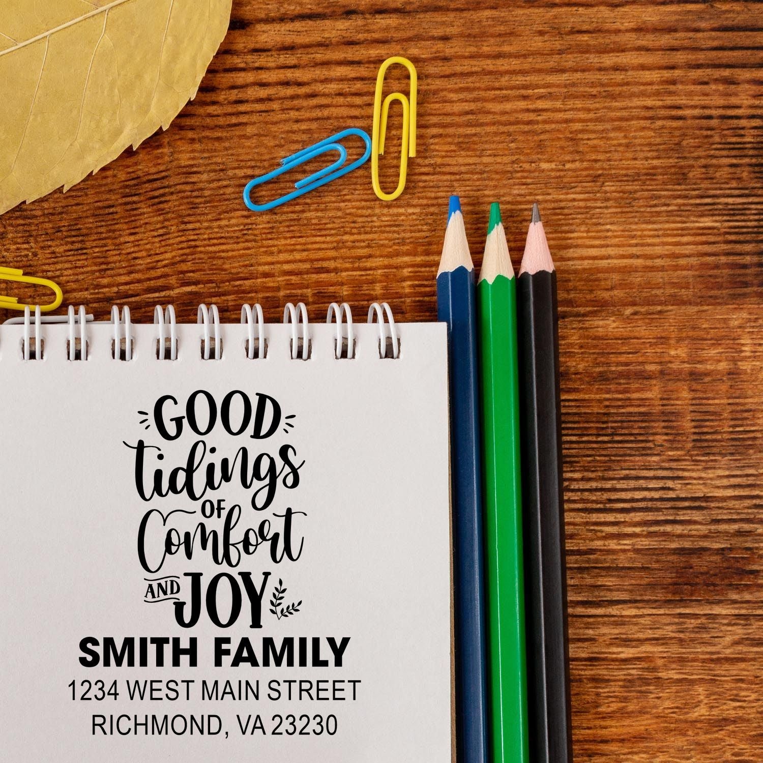 Personalized holiday rubber stamp with Good Tidings of Comfort and Joy for Smith Family cards and address labels.