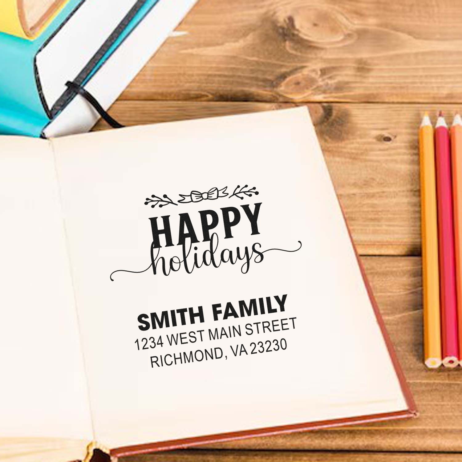 Custom holiday rubber stamp with family name and address for personalized holiday cards and stationery.