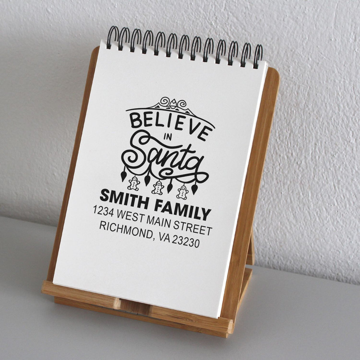 Personalized Believe in Santa family address rubber stamp for Christmas cards and holiday mailings.