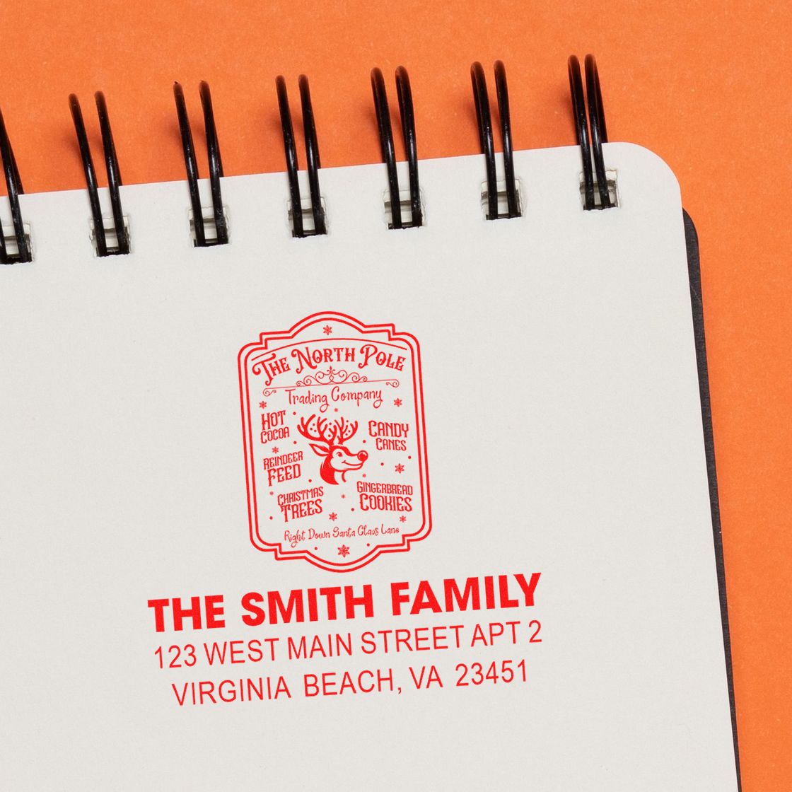 Personalized holiday address rubber stamp for the Smith family with a North Pole design and festive return mailing details.