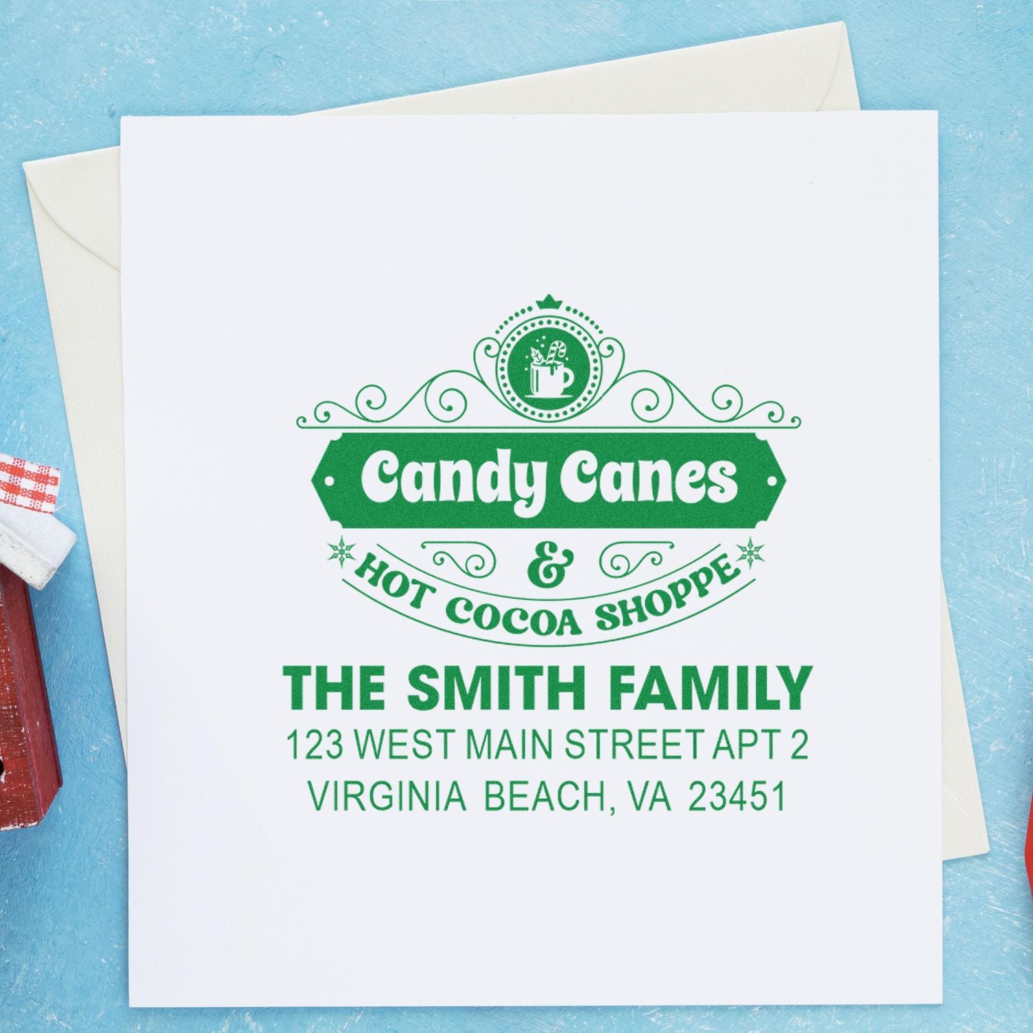 Custom holiday rubber stamp with Candy Canes & Hot Cocoa Shoppe and The Smith Family return address imprint.