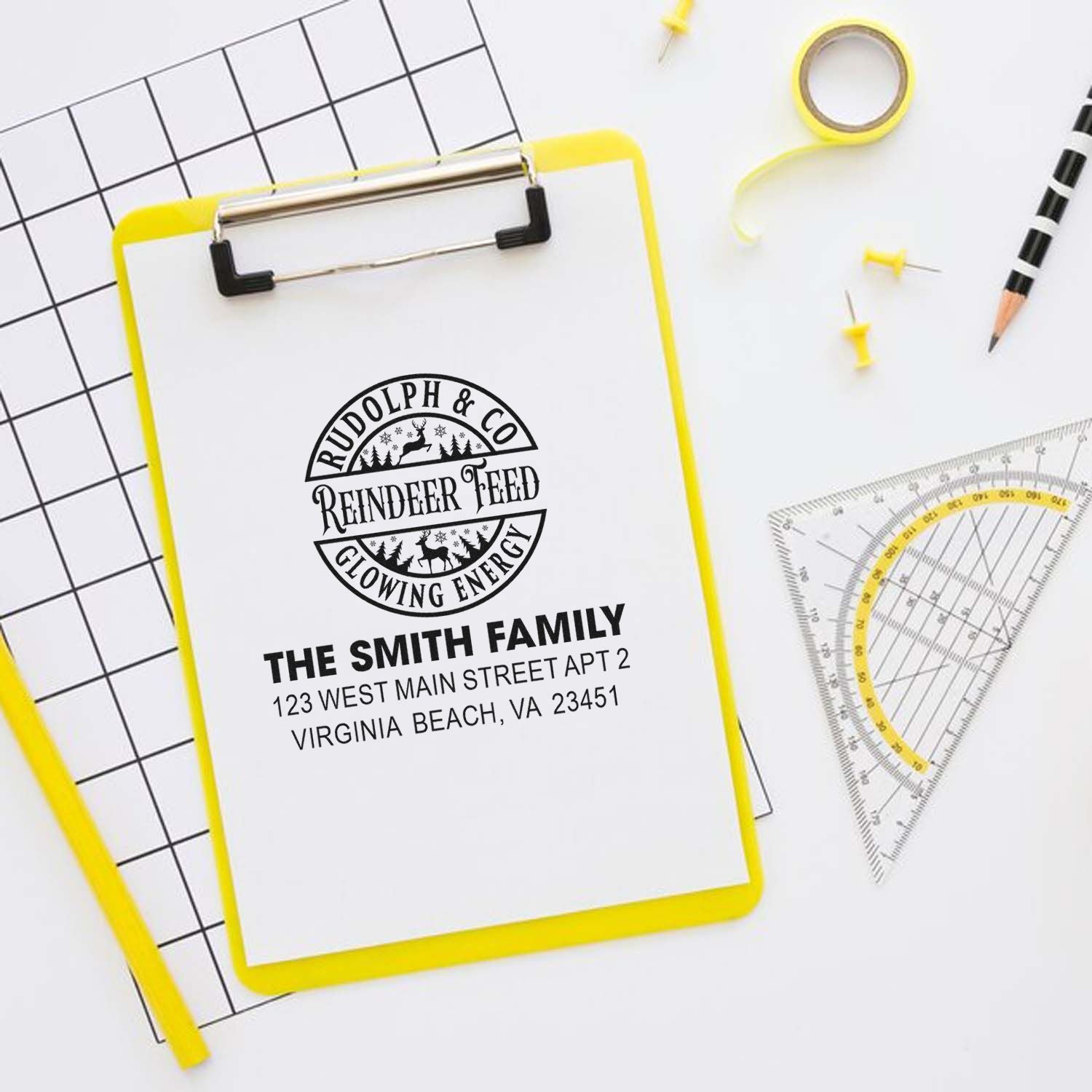 Custom rubber address stamp with family name and logo, perfect for personalized mailing, branding, and holiday cards.