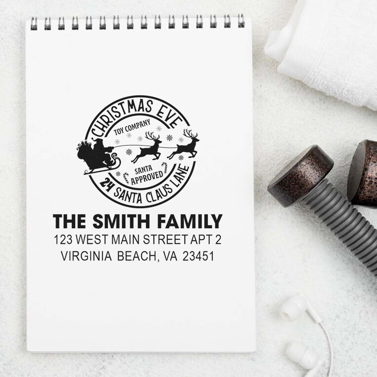 Custom Christmas rubber address stamp with Santa sleigh design and The Smith Family return address.