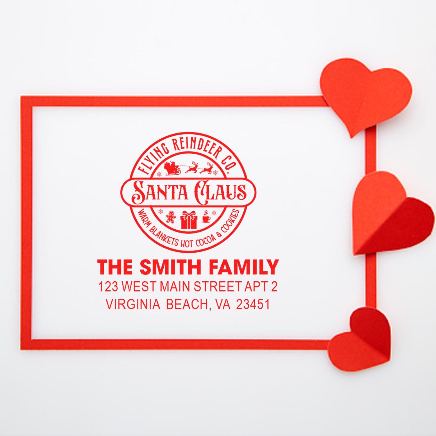 Personalized holiday return address rubber stamp with Santa Claus and Flying Reindeer Co. design for The Smith Family.