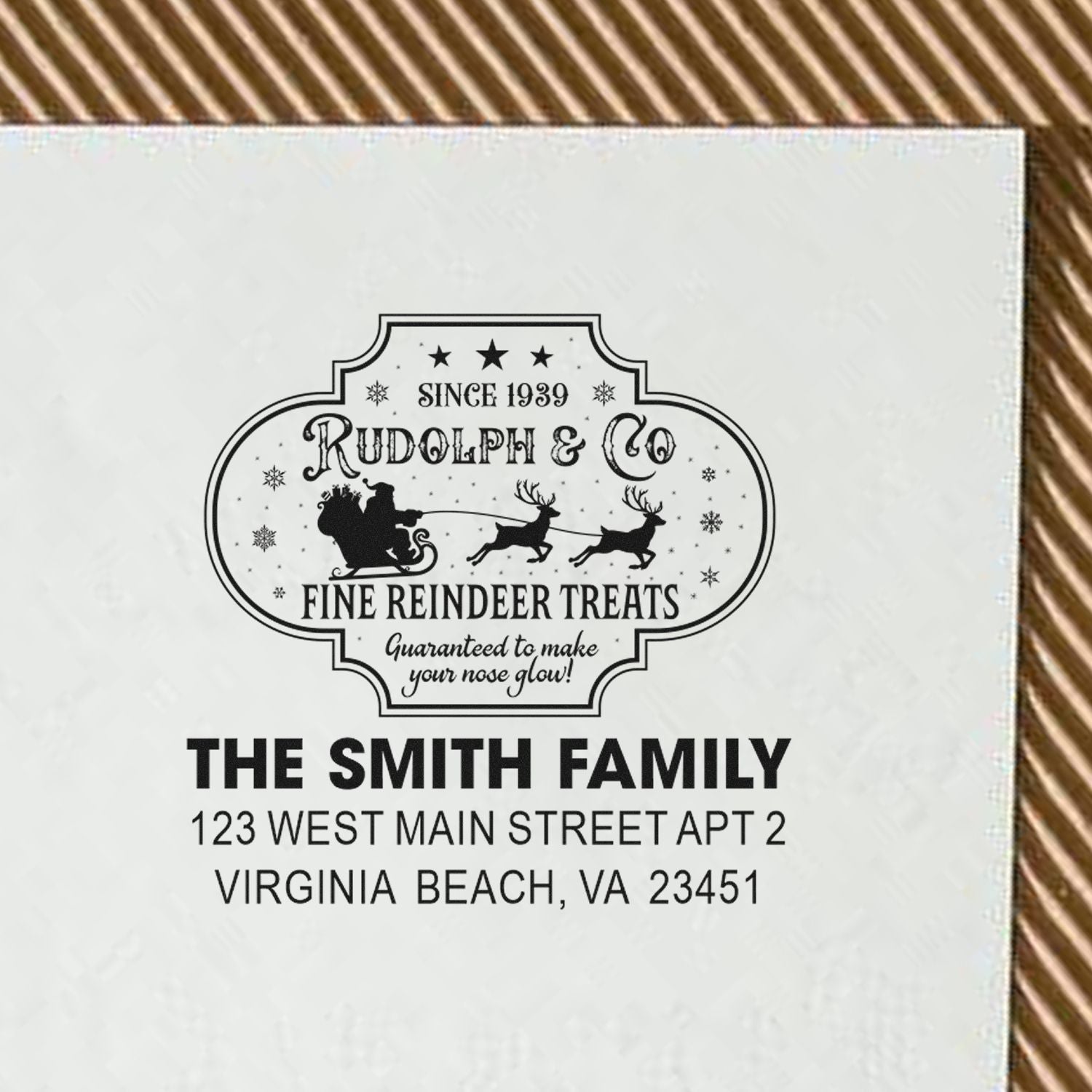 Custom holiday return address rubber stamp with Rudolph & Co reindeer design and The Smith Family address.
