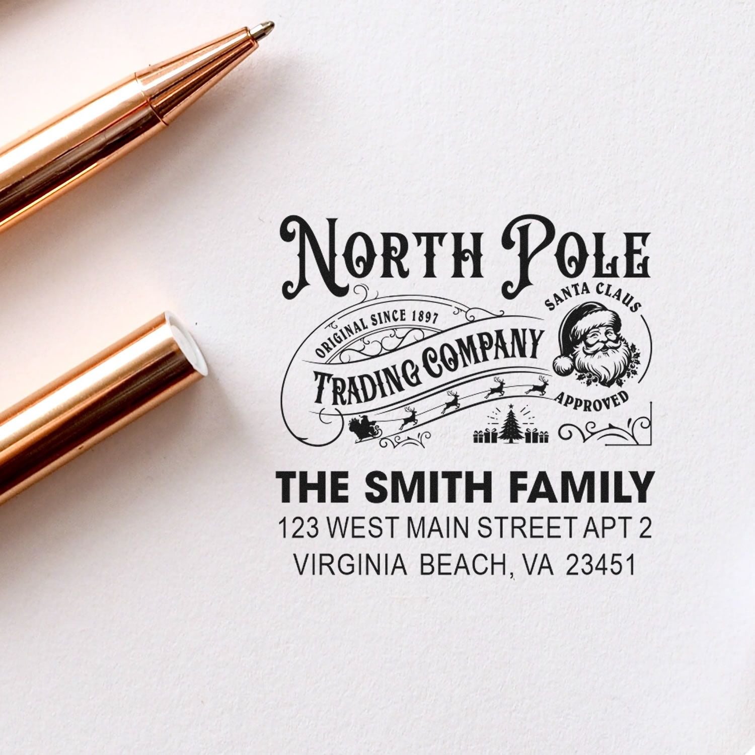 Custom Christmas return address rubber stamp with North Pole Trading Company design and The Smith Family address.